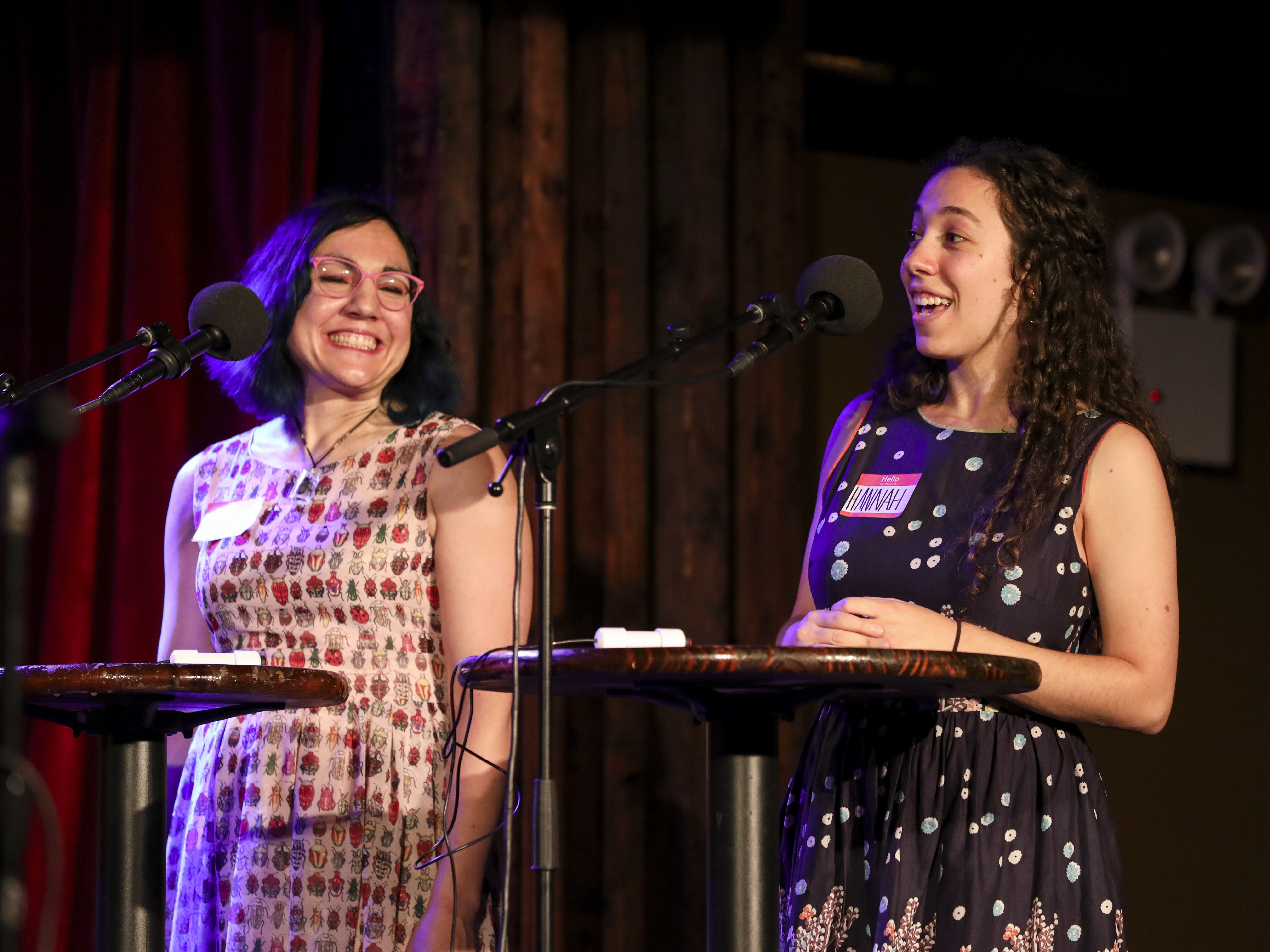 caption: Contestants Denise Yazak and Hannah Margolin play a trivia game on Ask Me Another at the Bell House in Brooklyn, New Yor