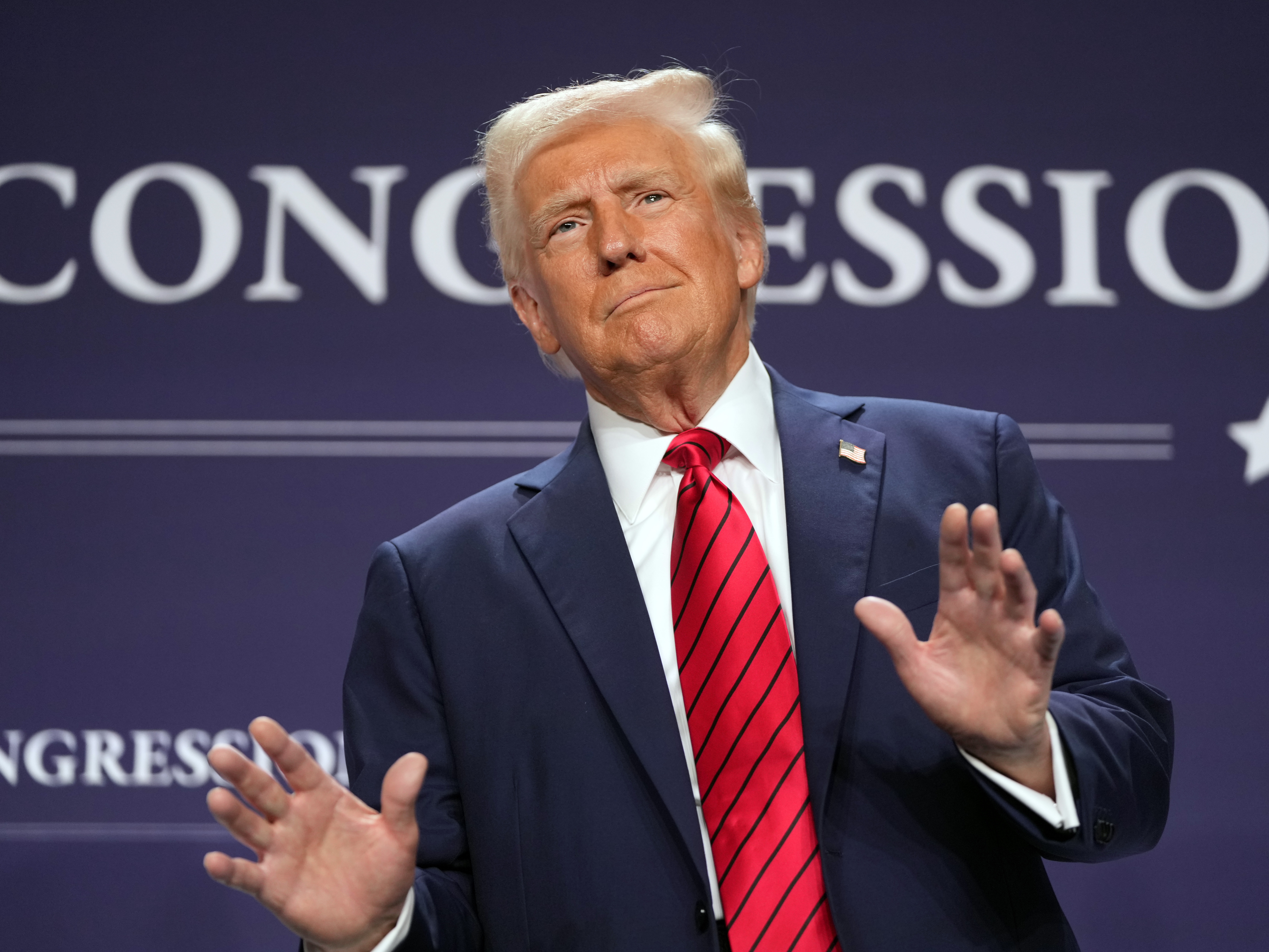 caption: President Trump arrives to speak at the House Republican members conference dinner at Trump National Doral Golf Club in Miami on Jan. 27.