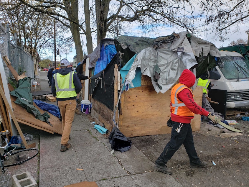 caption: There were two sweeps of homeless encampments in Seattle's Ballard neighborhood on Friday, April 15, 2022. Seattle is seeing far more sweeps as protections for the homeless due to Covid wane, and new Mayor Bruce Harrell makes good on campaign promises to reduce homelessness.
