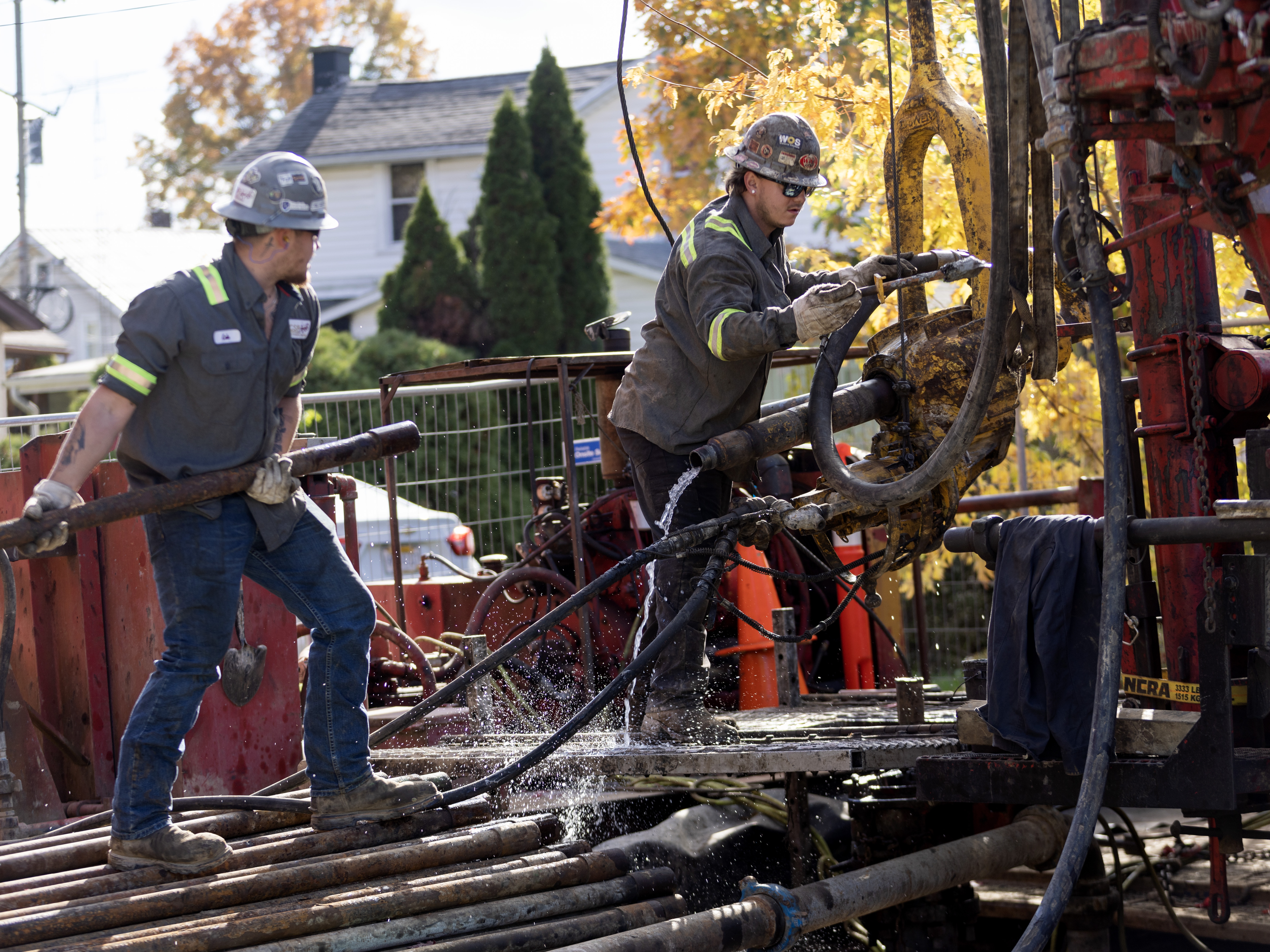 caption: A crew with the company CSR Services works on plugging an orphan well on a homeowner's property in Ashland, Ohio, on October 24, 2024.