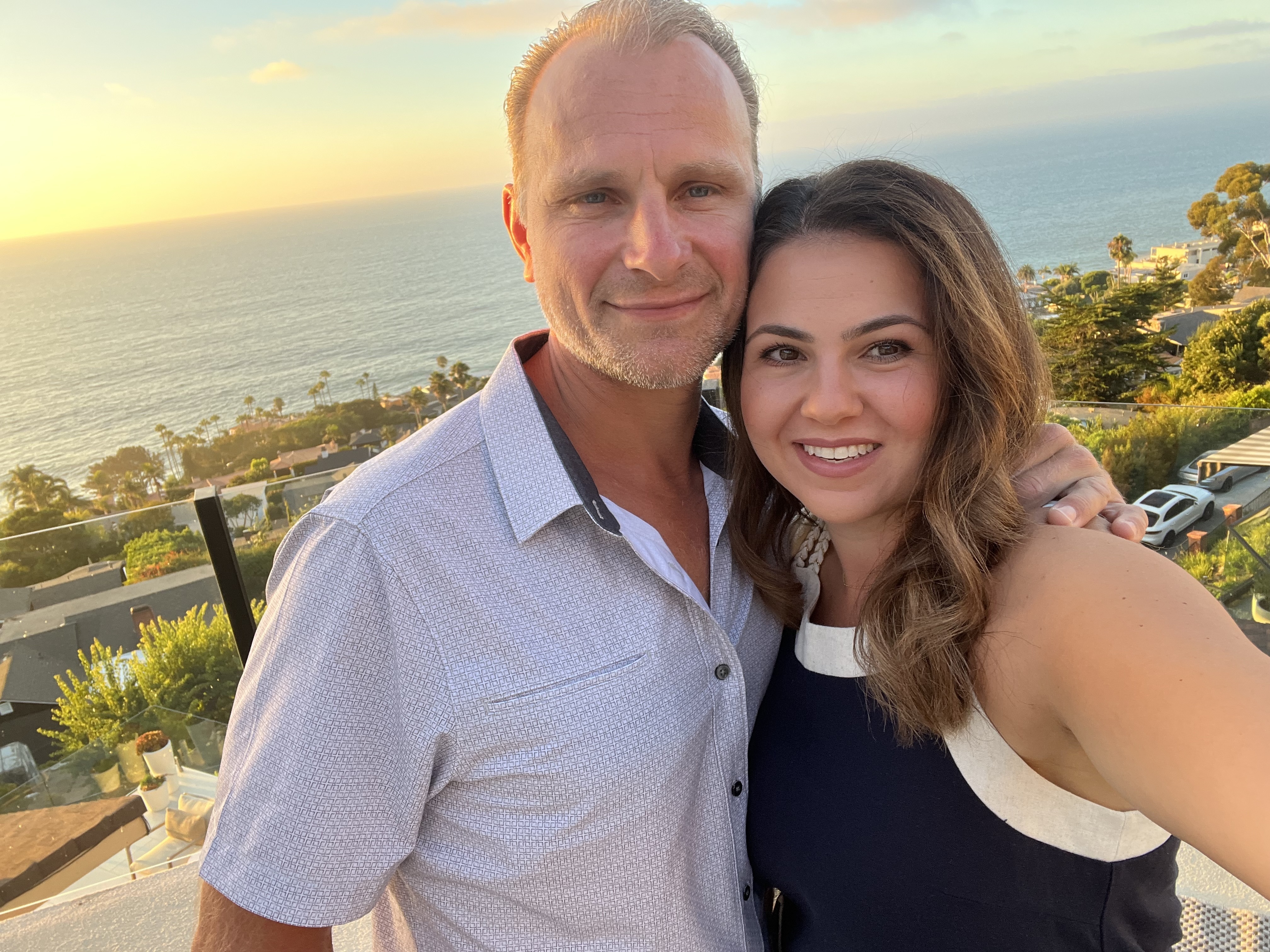 caption: Roman Surovtsev and Samantha Surovtsev are seen in a photo from August 2024.