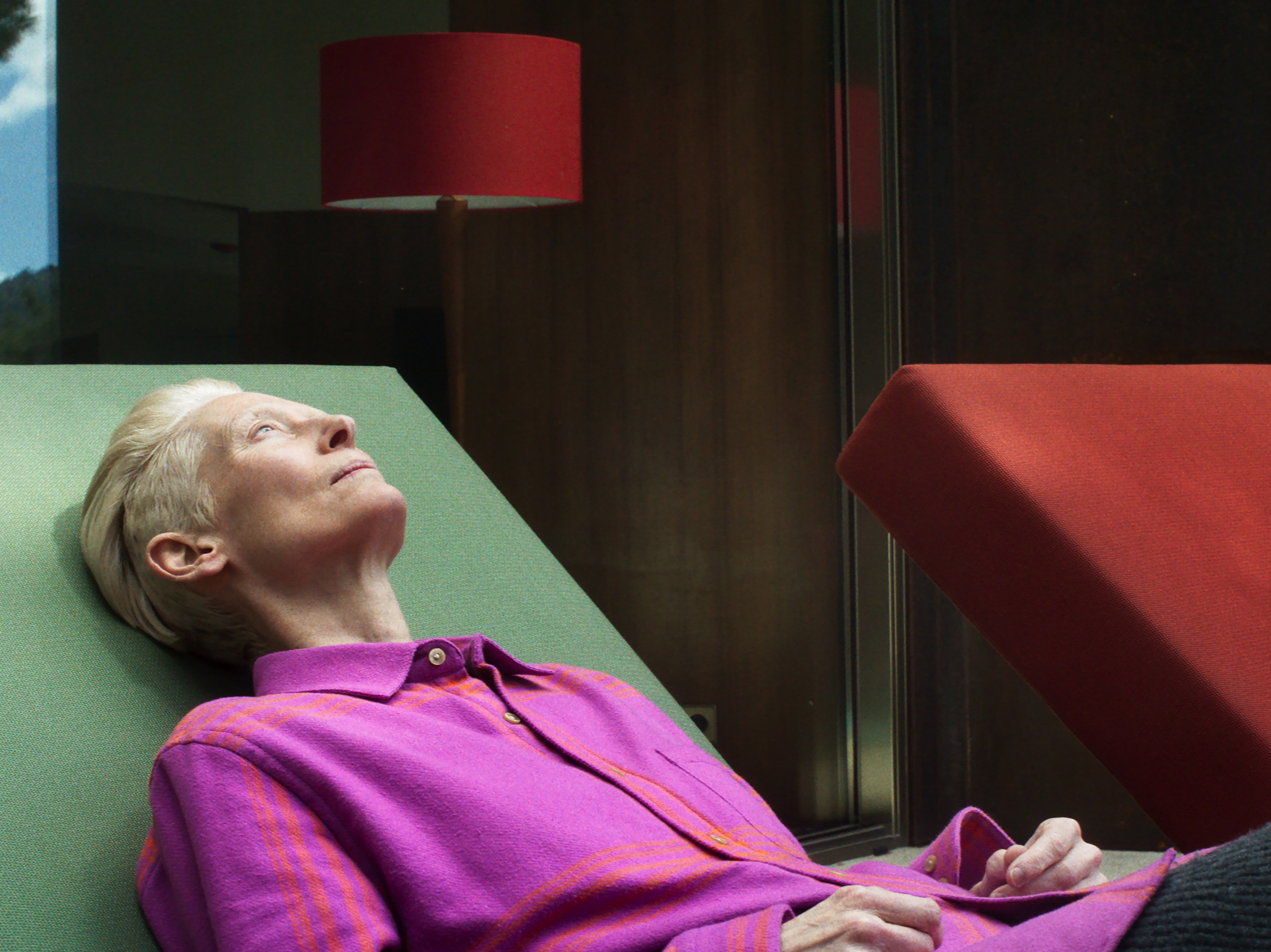 caption: Tilda Swinton plays a war correspondent who is dying of cancer in <em>The Room Next Door. </em>The film is based on the 2020 novel, <em>What Are You Going Through</em>, by Sigrid Nunez