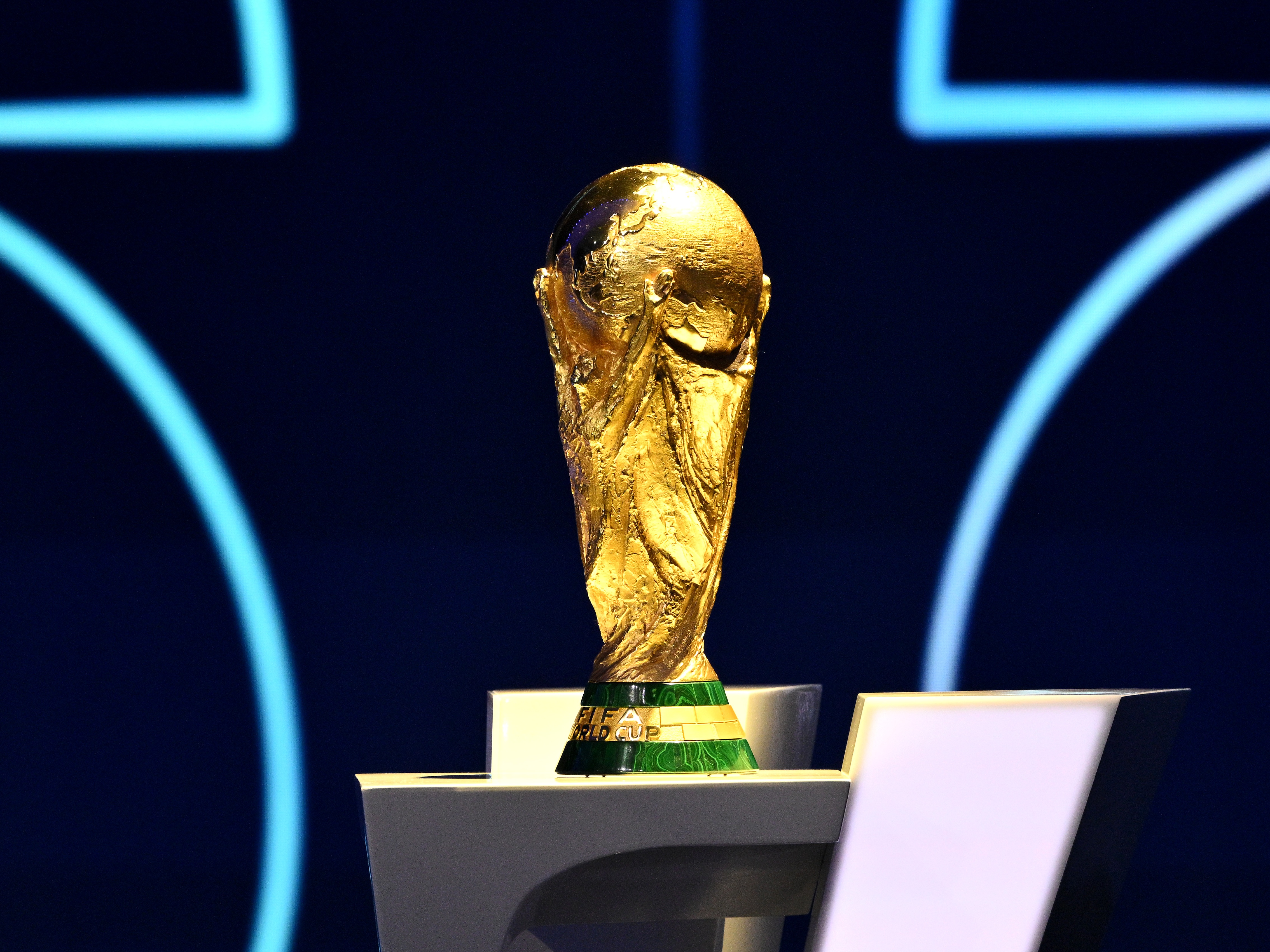caption: The FIFA World Cup trophy is displayed during the official draw ceremony held at the John F. Kennedy Center for the Performing Arts in Washington, D.C. on Dec. 5, 2025.