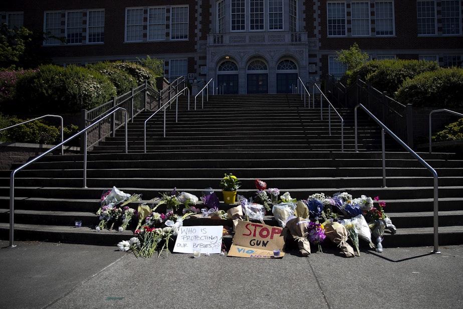 caption: A growing memorial for a 17-year-old student who was shot and killed is shown on Friday, June 7, 2024, at Garfield High School in Seattle.