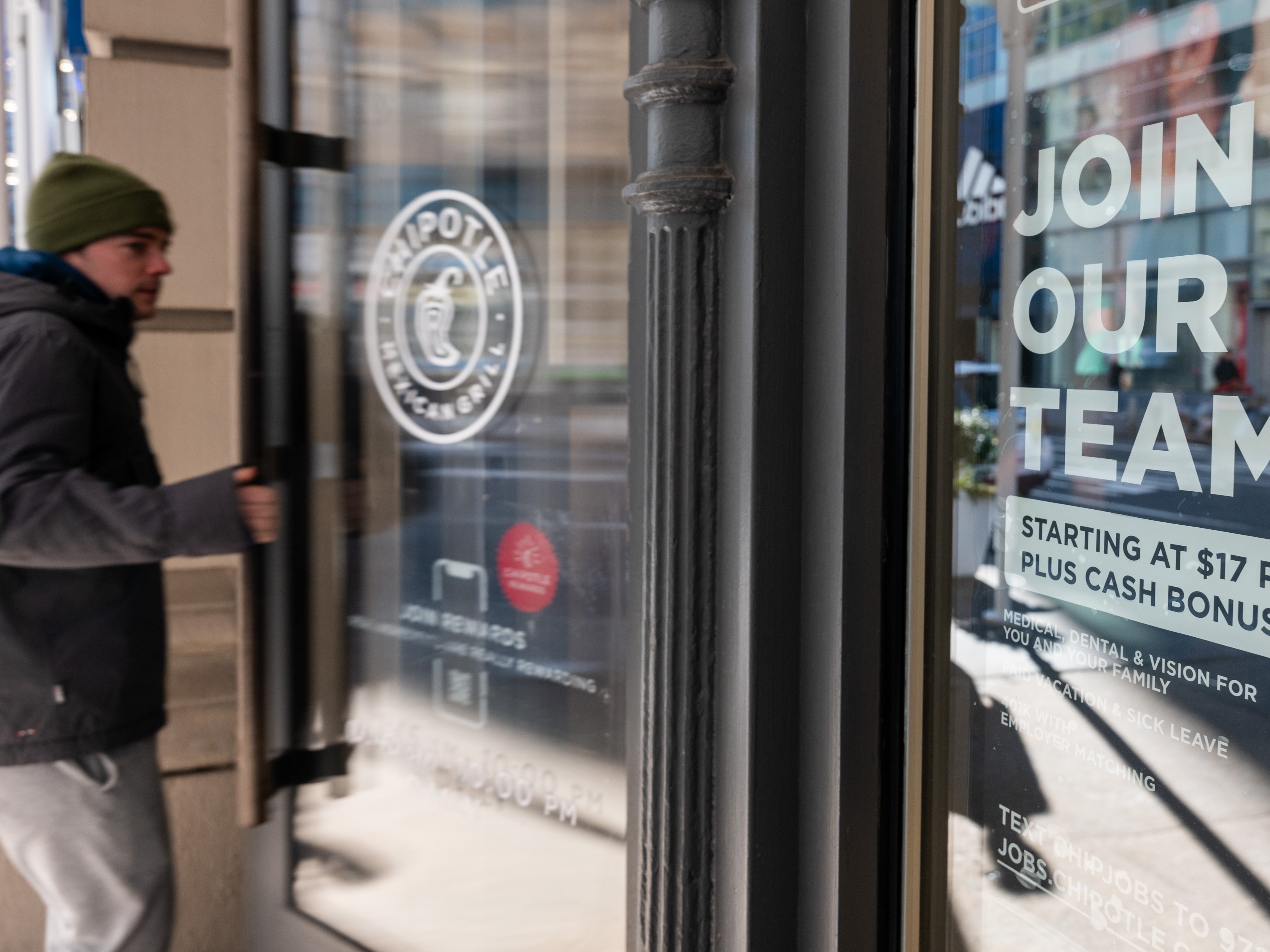 caption: U.S. employers continued to add jobs last month, but layoff notices have also increased to their highest level since the early months of the pandemic.