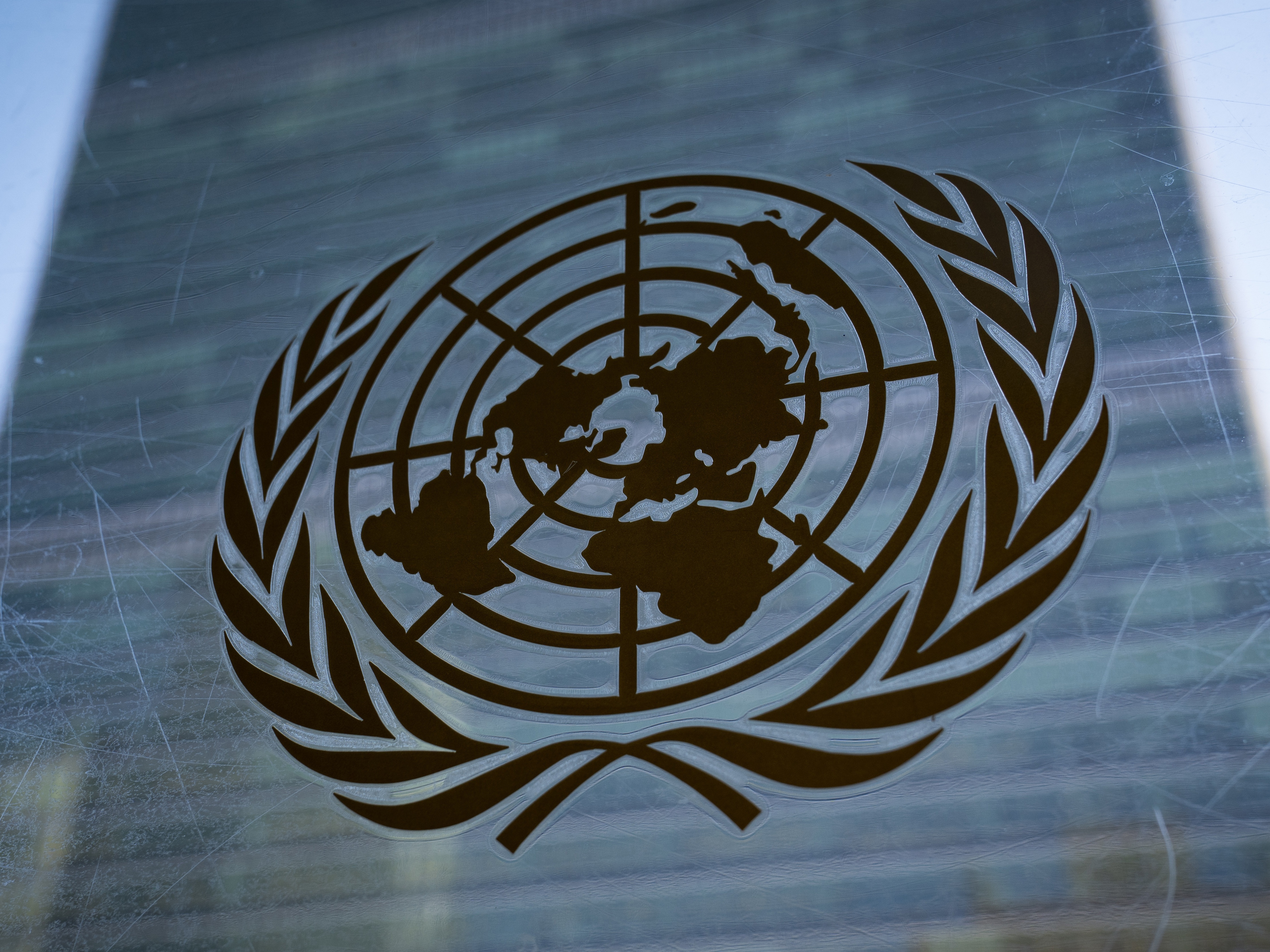 caption: The symbol of the United Nations is displayed outside the Secretariat Building, Feb. 28, 2022, at United Nations Headquarters. 