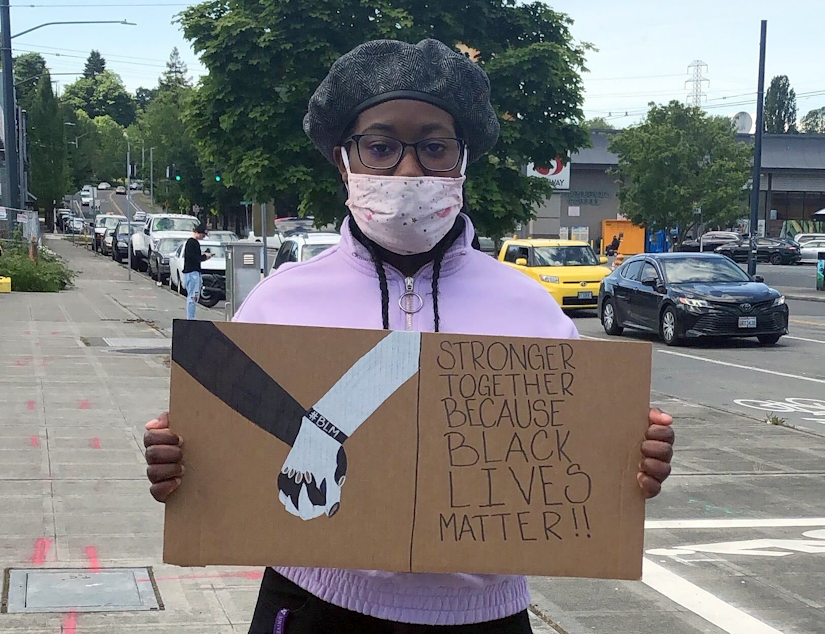 caption: Rainier Beach High School student Angelina Riley protested Seattle School District's relationship with Seattle Police Department on June 5, 2020.