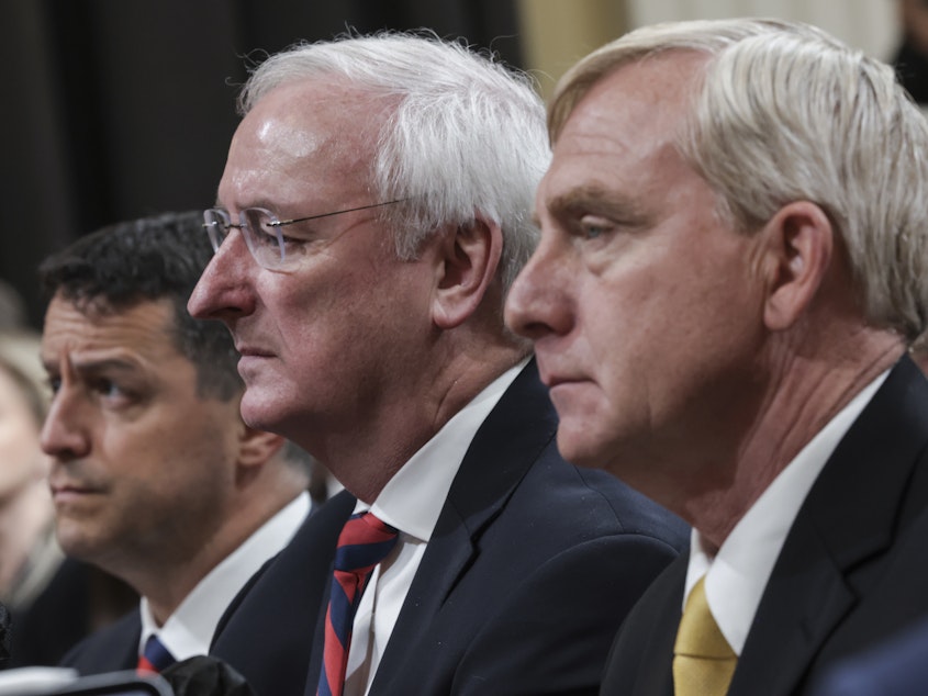 caption: From left, Steven Engel, former assistant attorney general for the Office of Legal Counsel, Jeffrey Rosen, former acting attorney general, and Richard Donoghue, former acting deputy attorney General, testify before the House Select Committee to Investigate the January 6th Attack on the U.S. Capitol on Thursday.