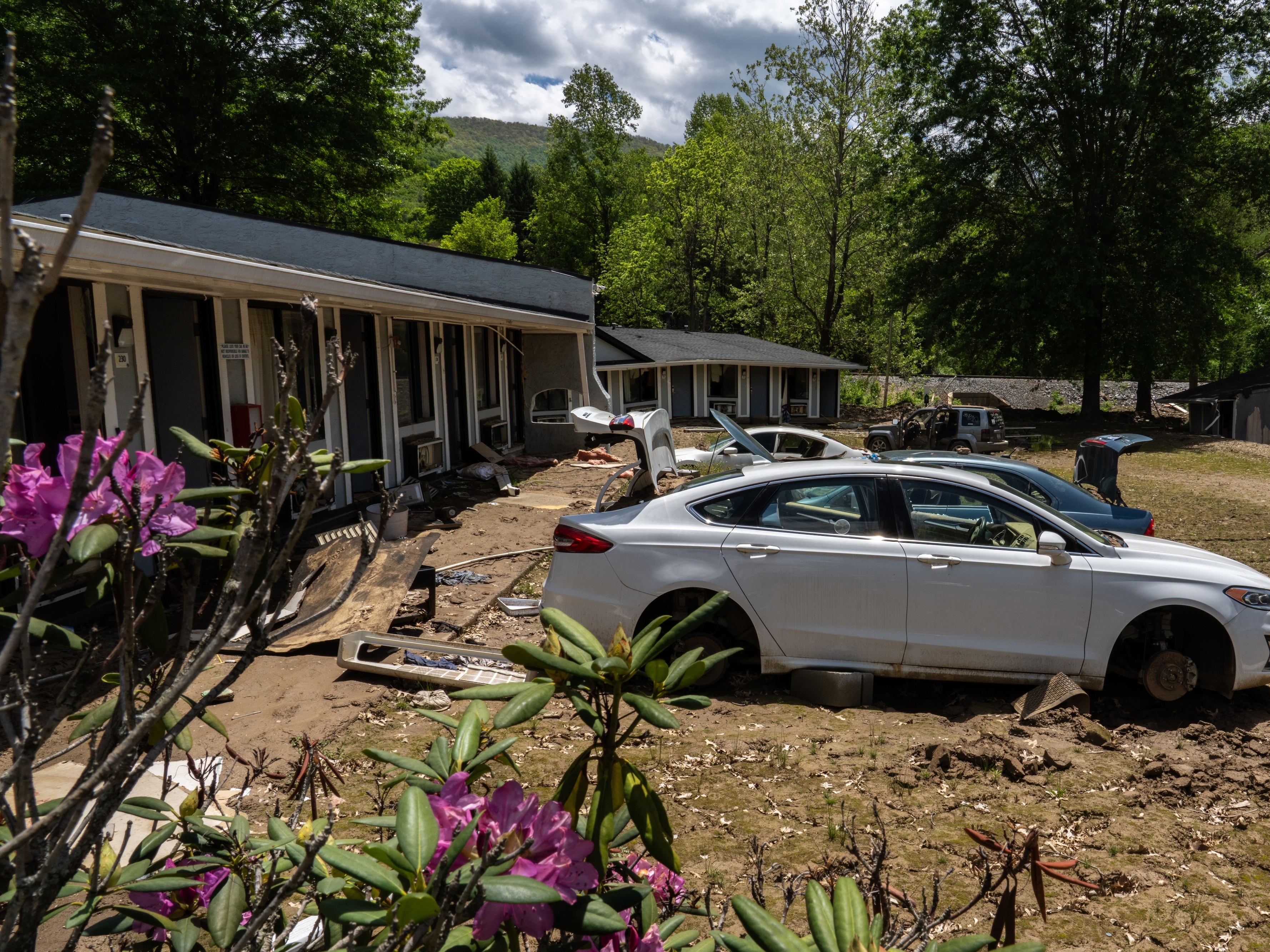 caption: The Super 8 Motel in Swannanoa has sat vacant and destroyed since Hurricane Helene hit western North Carolina in September 2024.