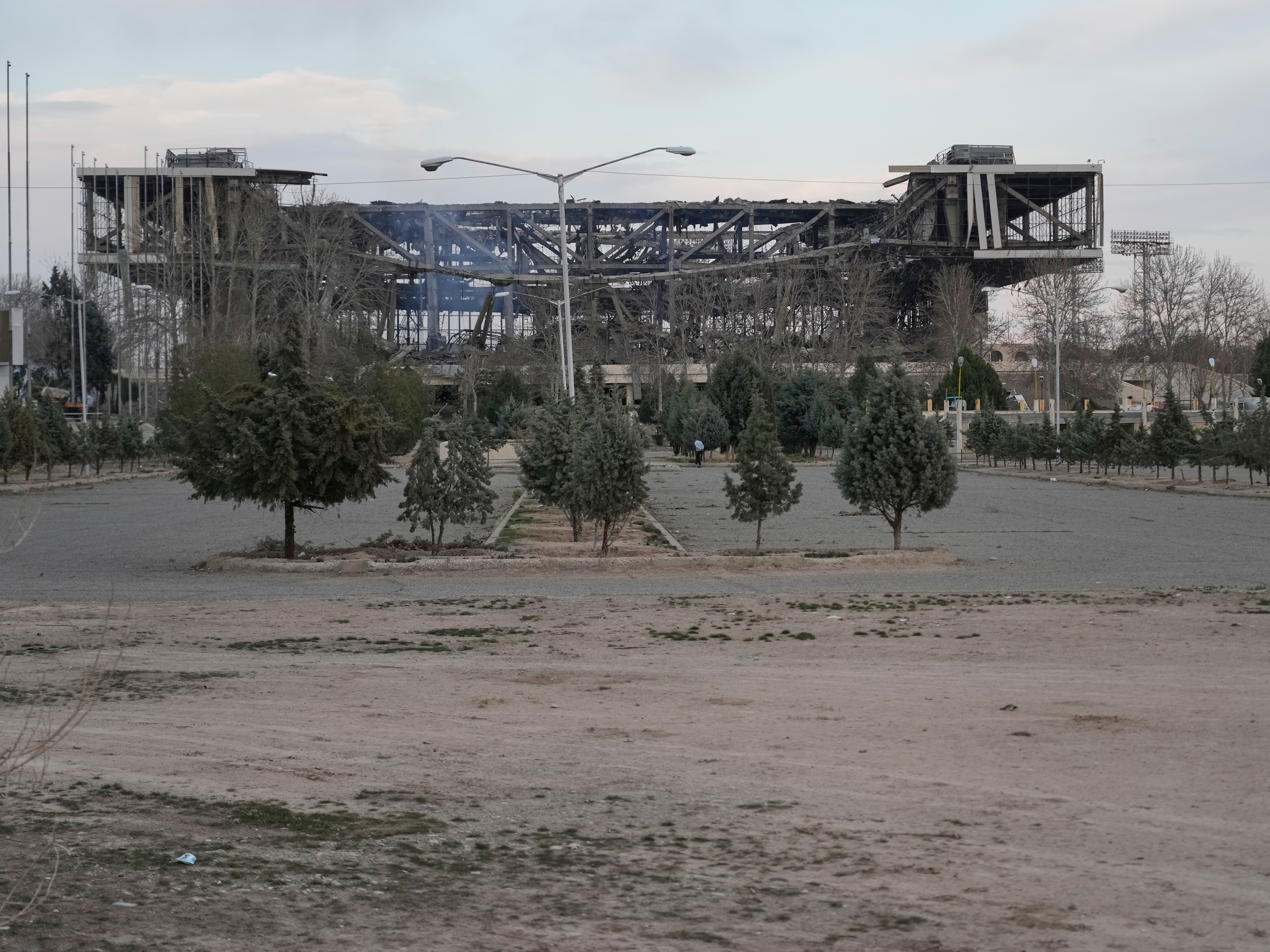 caption: The damaged 12,000-seat Azadi indoor stadium is seen after being struck during ongoing U.S.–Israeli military strikes in Tehran, Iran, on Thursday.