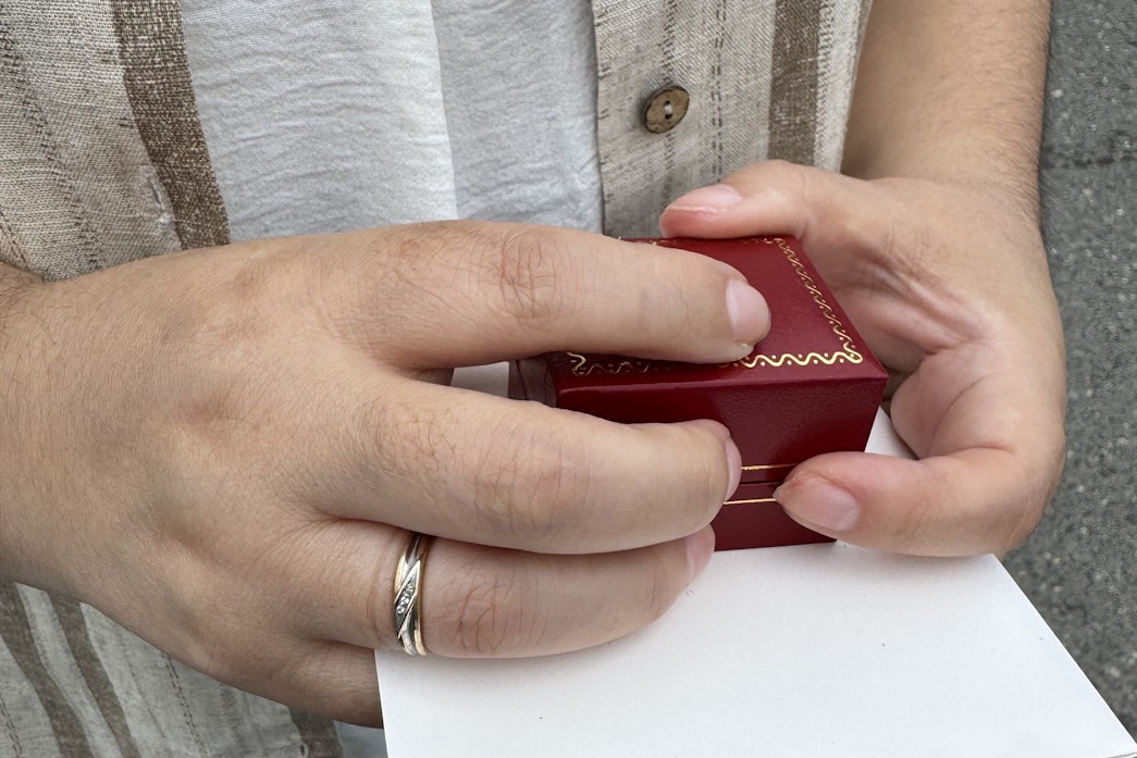 caption: The wife of a Kent, Washington, woman who is detained at the ICE jail in Tacoma, holds the ring for their wedding.