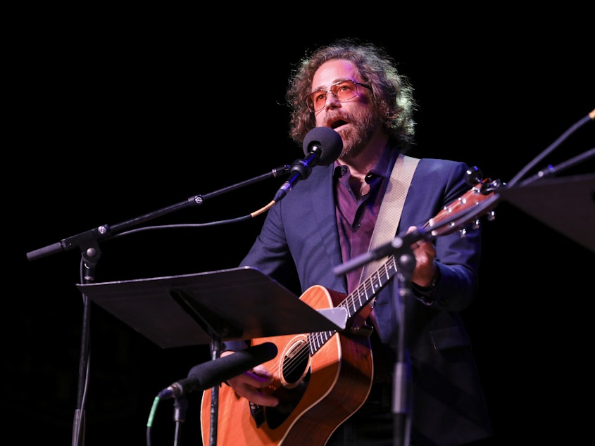 caption: House musician Jonathan Coulton leads a parody game on Ask Me Another at the Pageant in St. Louis, Missouri.