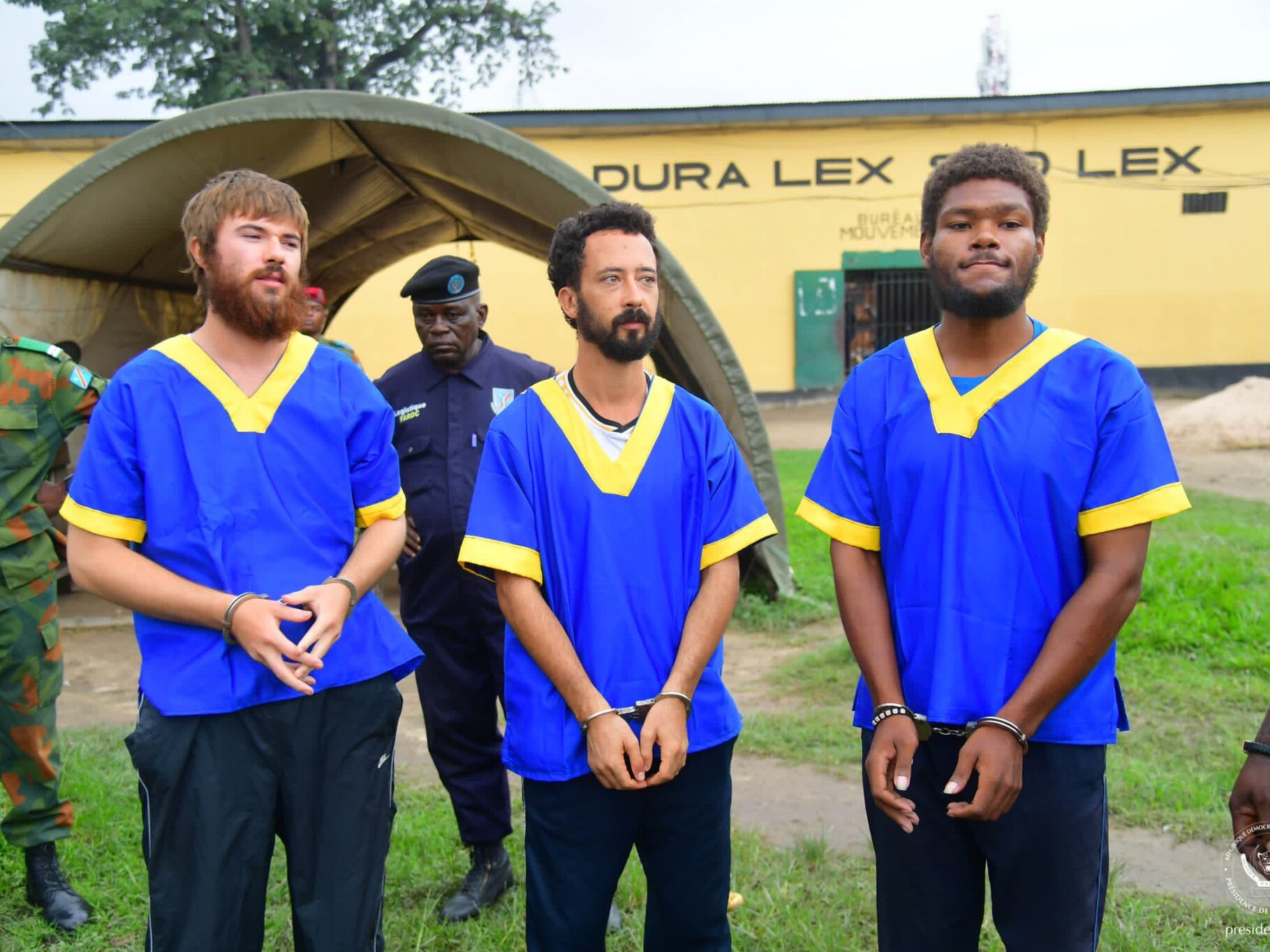 caption: Left to right: Tyler Thompson Jr., Benjamin Reuben Zalman-Polun and Marcel Malanga upon their release from a Congolese prison.