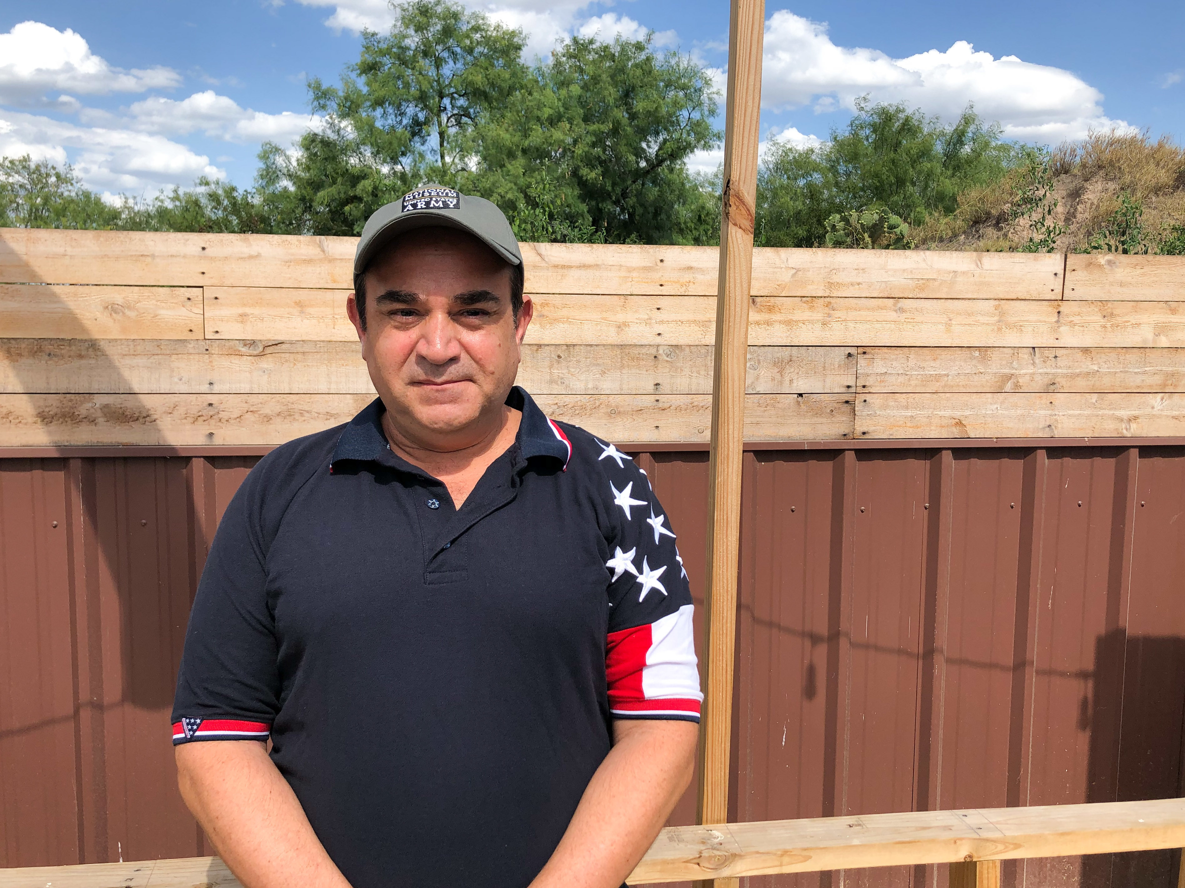 caption: Ross Barrera, Starr County GOP chairman, wants a border wall to stop unauthorized migrants who he says hike up from the Rio Grande on the path behind his fence.