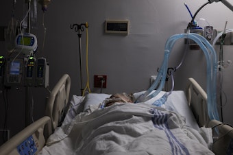 caption: A COVID-19 patient in the intensive care unit at United Memorial Medical Center in Houston on July 28.