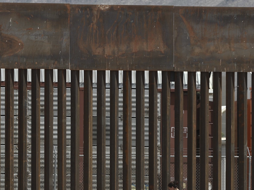 caption: The border wall set back from the geographical border, in El Paso, Texas. The White House said Thursday that an appeals court ruling has cleared the way for border wall construction to resume.