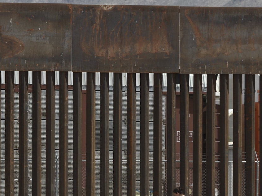 caption: The border wall set back from the geographical border, in El Paso, Texas. The White House said Thursday that an appeals court ruling has cleared the way for border wall construction to resume.