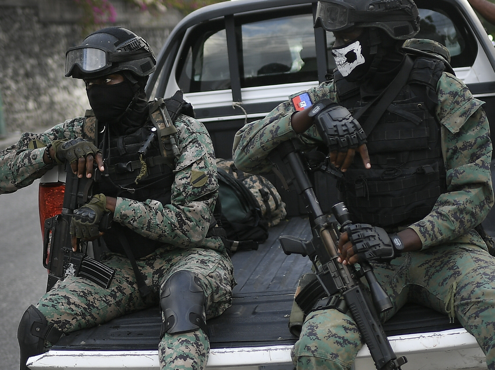 caption: Soldiers stand guard near the residence of Interim President Claude Joseph in Port-au-Prince, Haiti, on Sunday, four days after the assassination of Haitian President Jovenel Moïse.