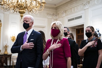 caption: President Joe Biden and first lady Jill Biden attended the virtual presidential inaugural prayer service from the State Dining Room of the White House.