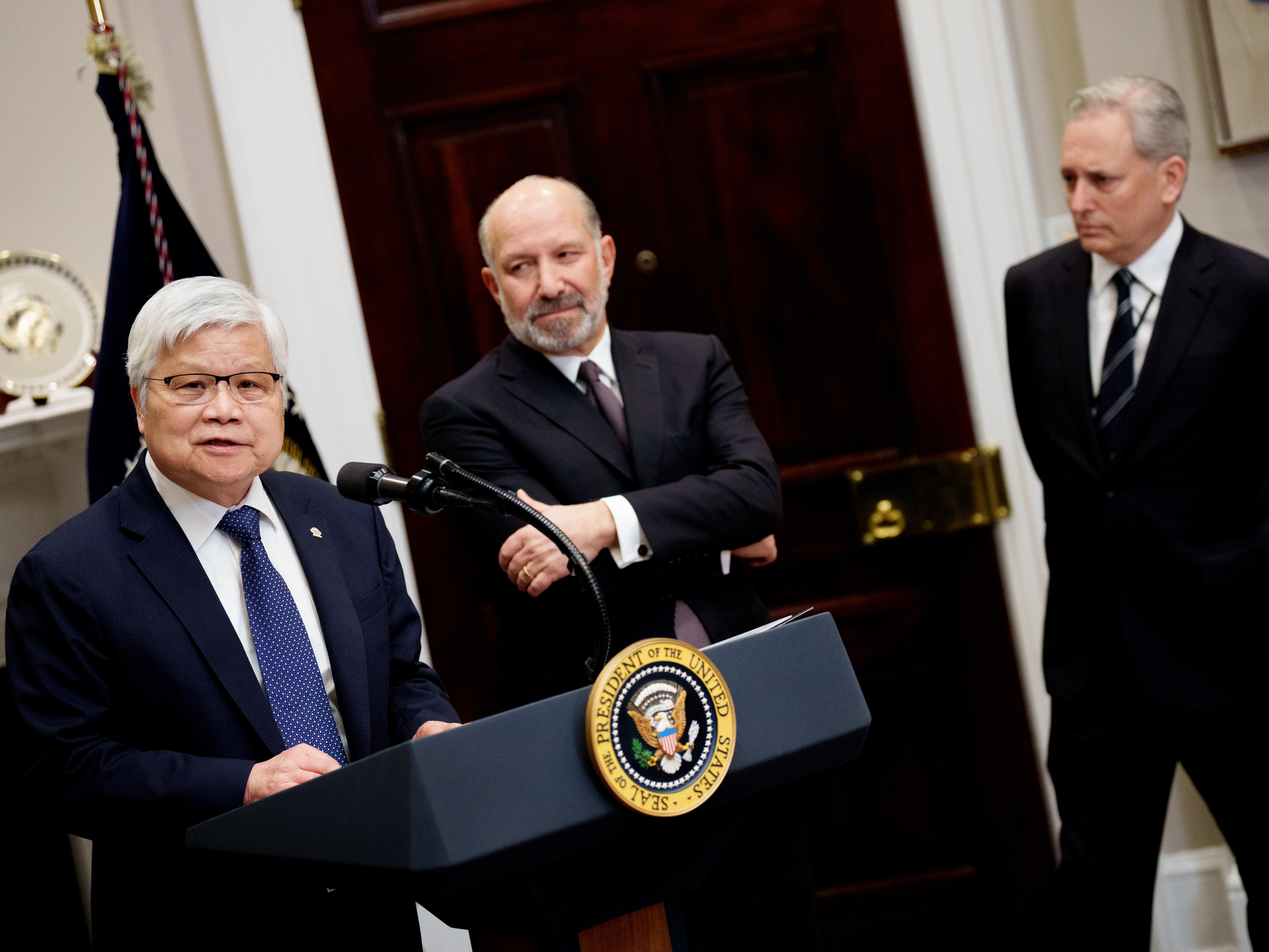 caption: C.C. Wei, the CEO of Taiwan Semiconductor Manufacturing Company (TSMC), is shown at left and accompanied by U.S. Commerce Secretary Howard Lutnick and David Sacks, U.S. President Trump's AI and crypto czar, at the White House on March 3. Trump announced that Taiwan Semiconductor Manufacturing Company, one of the largest manufacturers of semiconductor chips, plans to invest $100 billion in new manufacturing facilities in the United States.