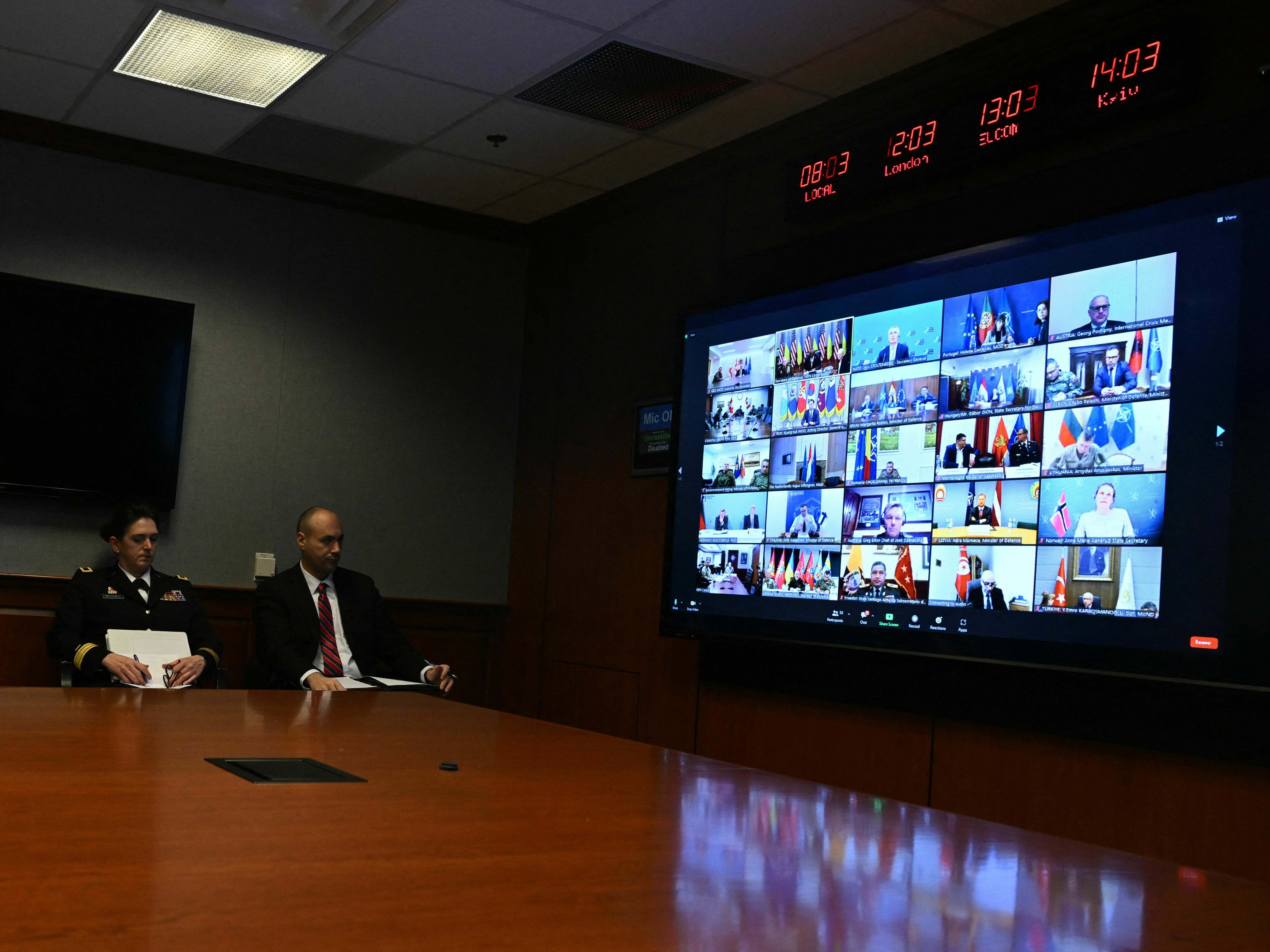 caption: Officials at the Pentagon attend a virtual meeting of more than 50 nations on the war in Ukraine, on March 15.