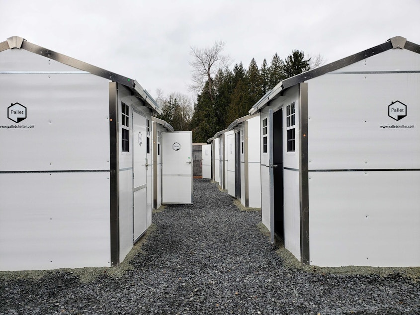 caption: Rows of tiny homes at the Tulalip Tribes village open on Monday, Feb. 6, 2023. 