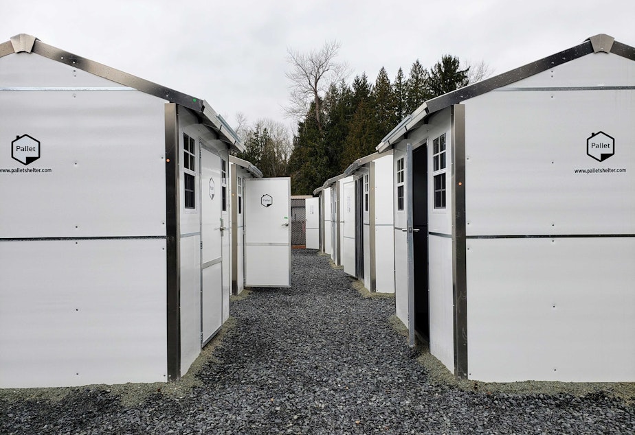 caption: Rows of tiny homes at the Tulalip Tribes village open on Monday, Feb. 6, 2023. 