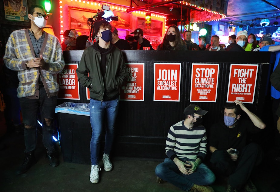 caption: The night of Kshama Sawant's recall vote. Sawant supporters gather at Chop Suey in Seattle's Capitol Hill neighborhood on December 7, 2021.