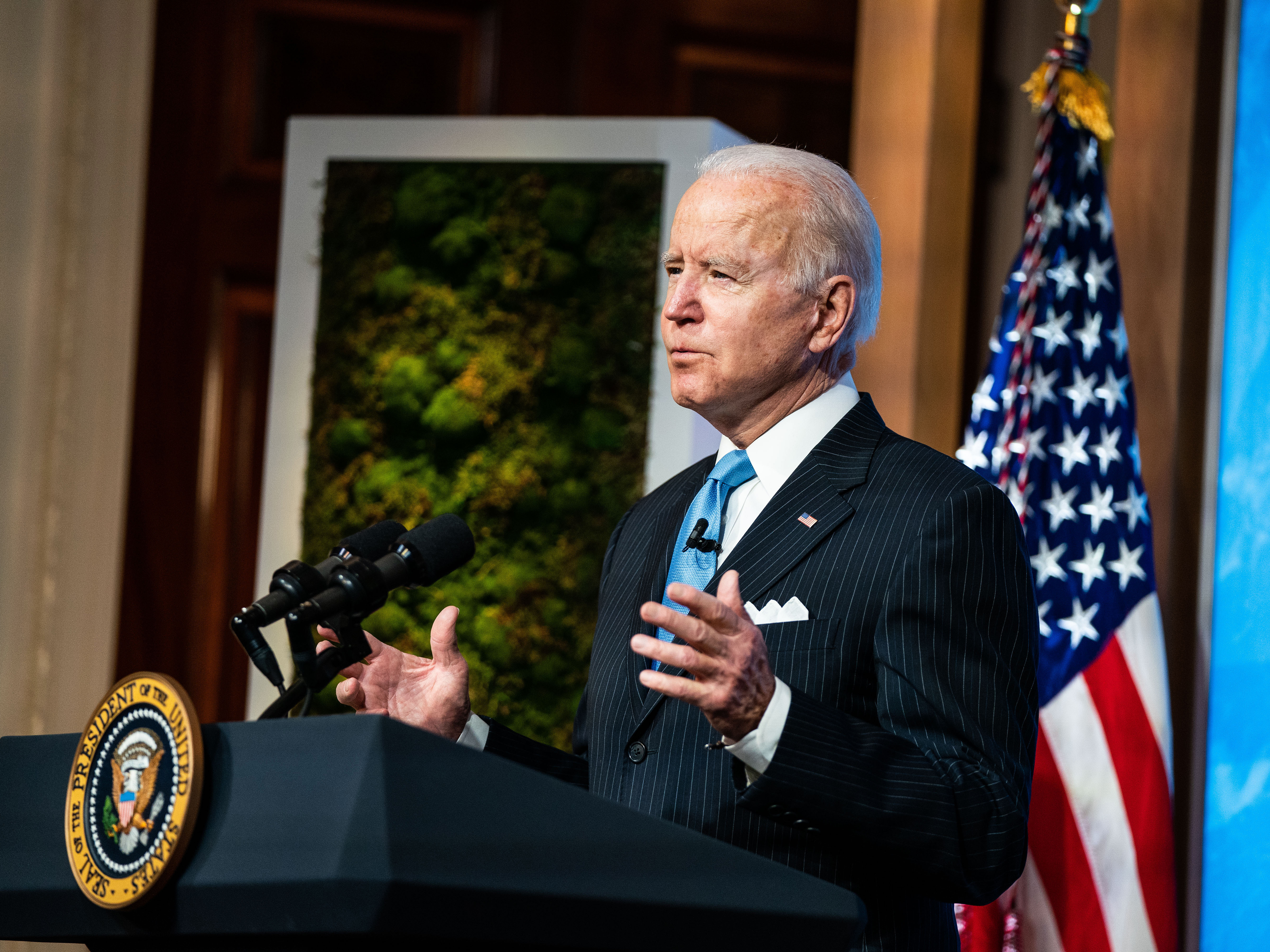 caption: President Biden plans to sign an executive order on Tuesday that will kick off the rulemaking process for a higher minimum wage for employees of federal contractors.