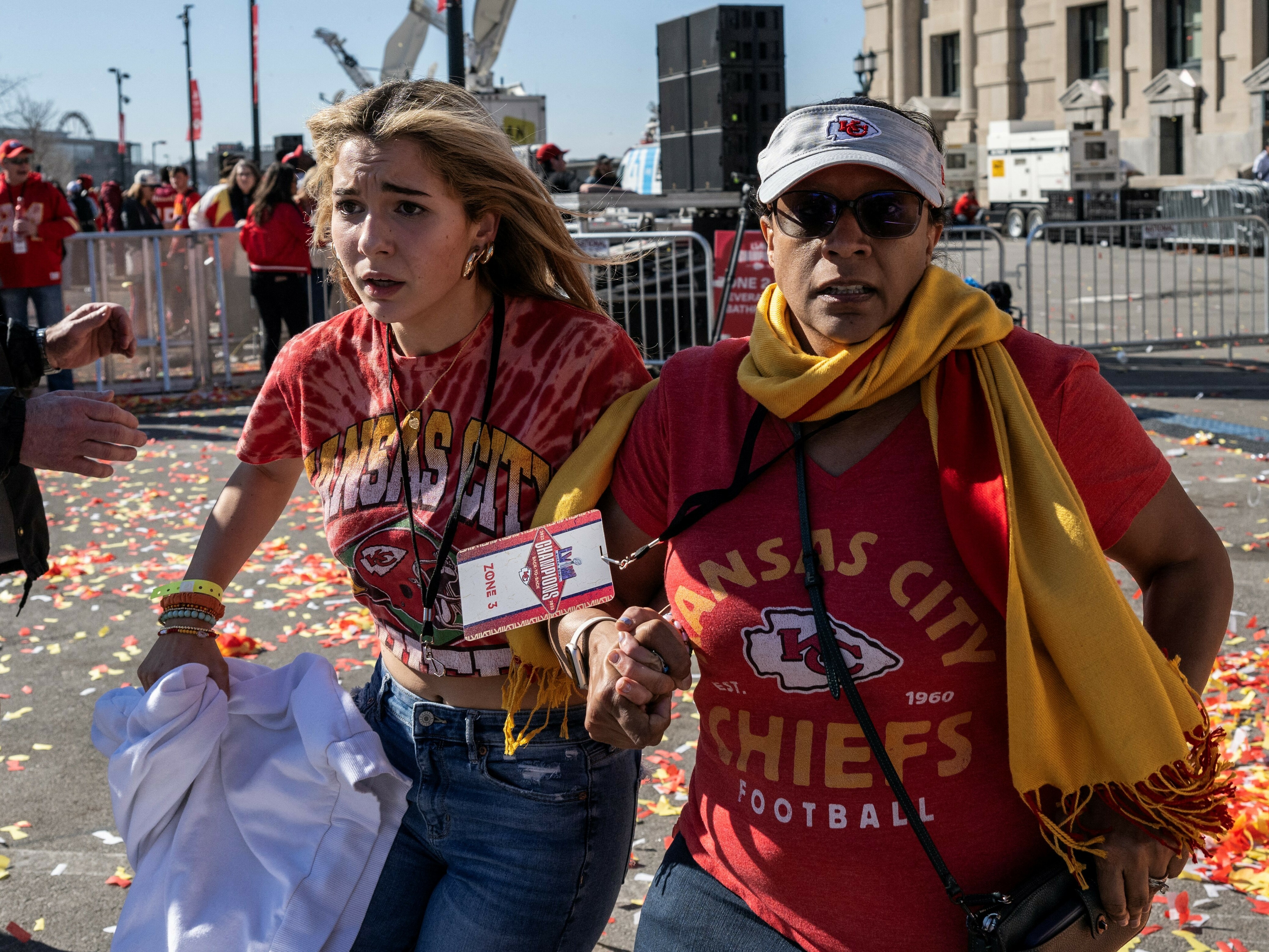 caption: People flee after shots were fired near the Kansas City Chiefs' Super Bowl victory parade on Feb.14 in Kansas City, Mo.