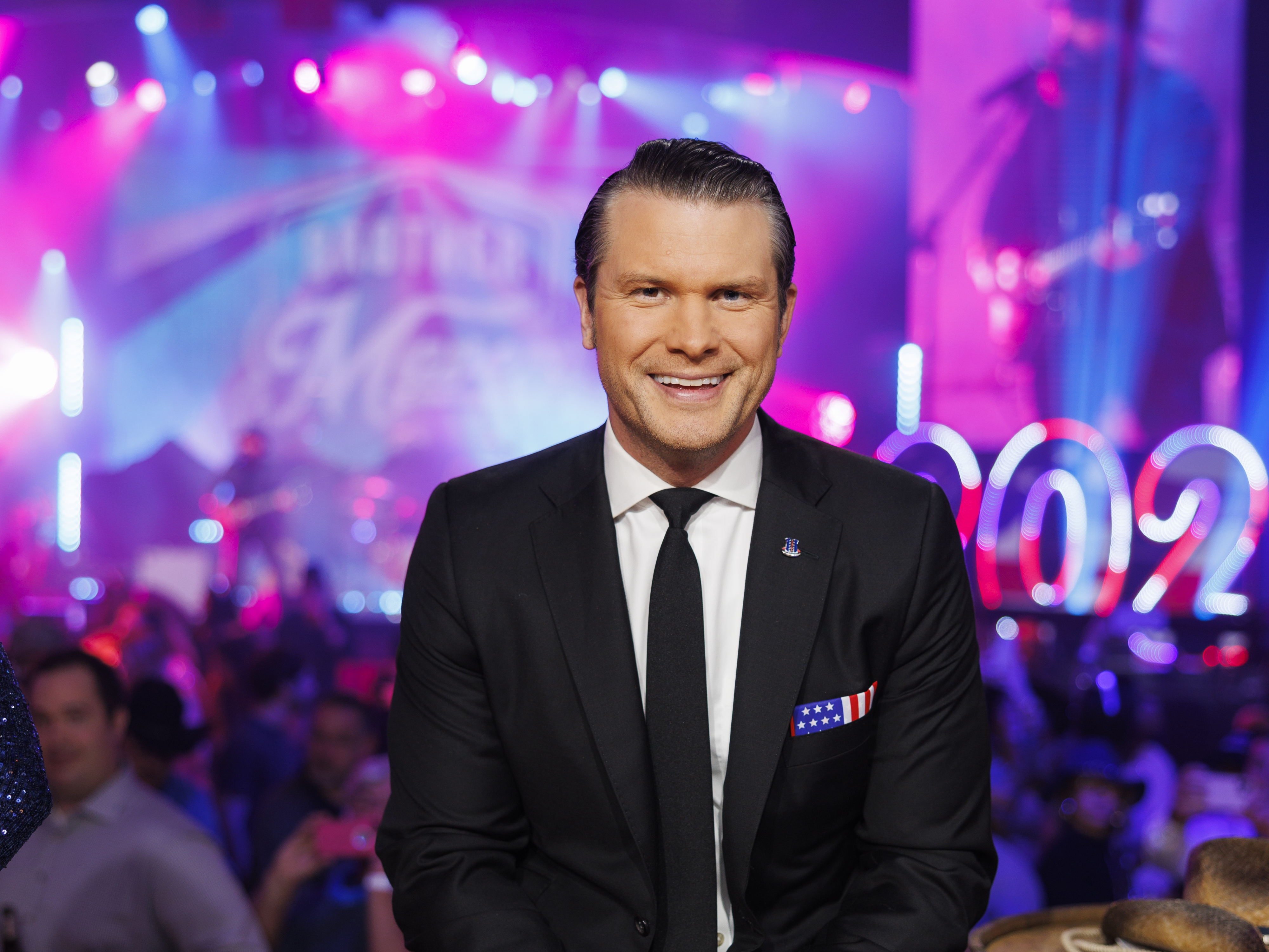 caption: Pete Hegseth, seen here on Dec. 31, 2021, paid a woman to settle her accusation of sexual assault against him, his lawyer says.