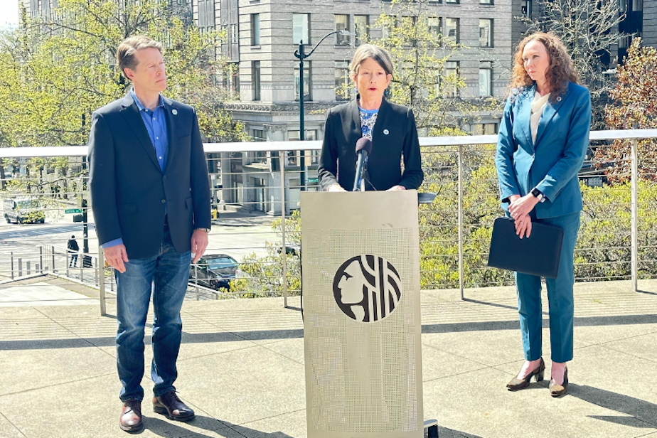 caption: Seattle Councilmembers Alex Pedersen (left) and Sara Nelson (center), and City Attorney Ann Davison (right) speak at a press event April 27, 2023, at City Hall. 