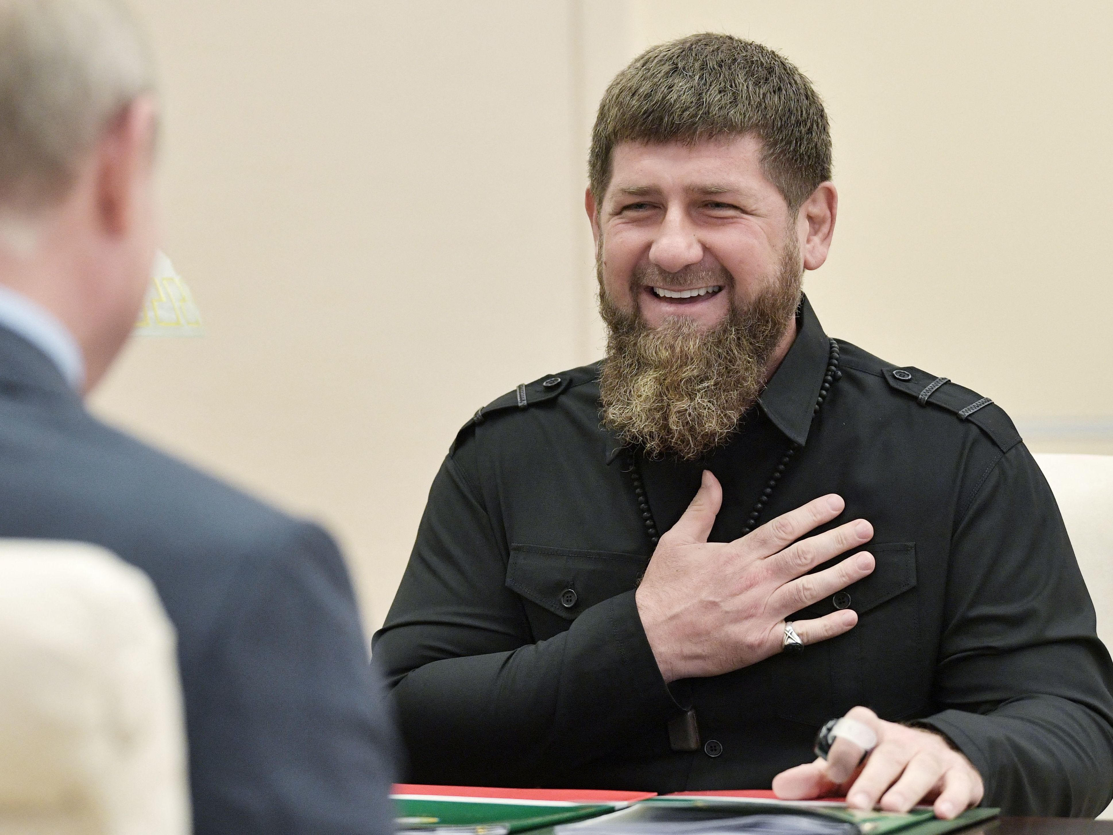 caption: The head of the Chechen Republic, Ramzan Kadyrov, speaks with Russian President Vladimir Putinin 2019.