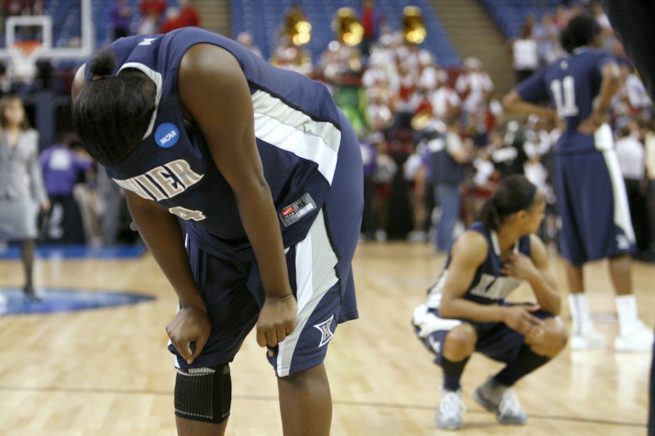 caption: Xavier guard Dee Dee Jernigan, left, and teammates react to a 55-53 loss to Stanford in the final of the NCAA college basketball tournament Sacramento Regional in Sacramento, Calif., Monday, March 29, 2010. (Steve Yeater/AP)