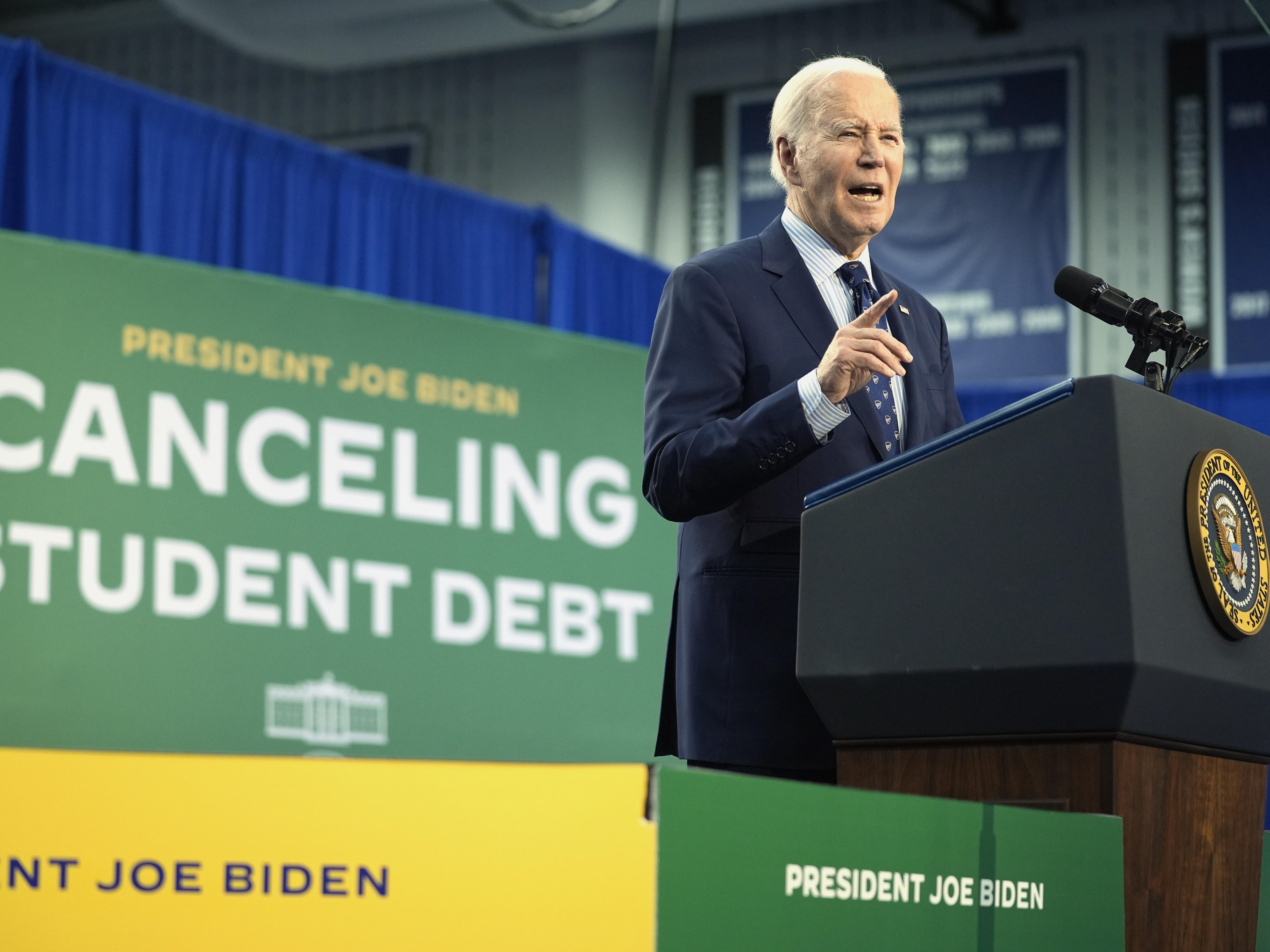 caption: President Biden speaks about student loan debt, April 8, 2024, in Madison, Wis.