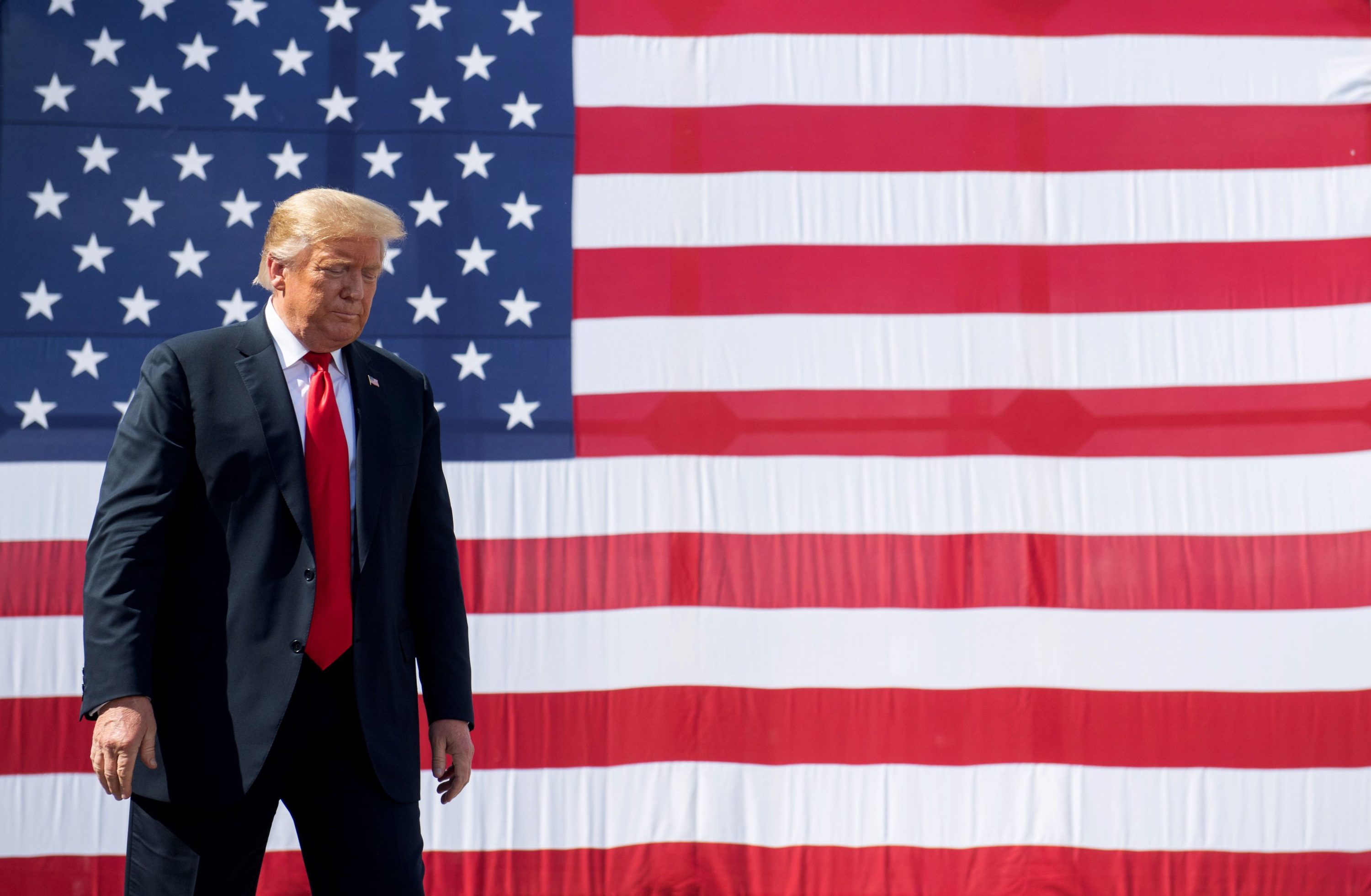 caption: US President Donald Trump gestures following a tour of Fincantieri Marinette Marine in Marinette, Wisconsin, June 25, 2020. (Saul Loeb/AFP) 