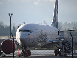 caption: An Alaska Airlines 737 Max 9 that made an emergency landing at Portland International Airport on Jan. 5 is parked in Portland, Ore., on Jan. 23. A door plug blew out shortly after the plane took off from Portland. There were no serious injuries, but it has renewed concerns about Boeing and production lapses.