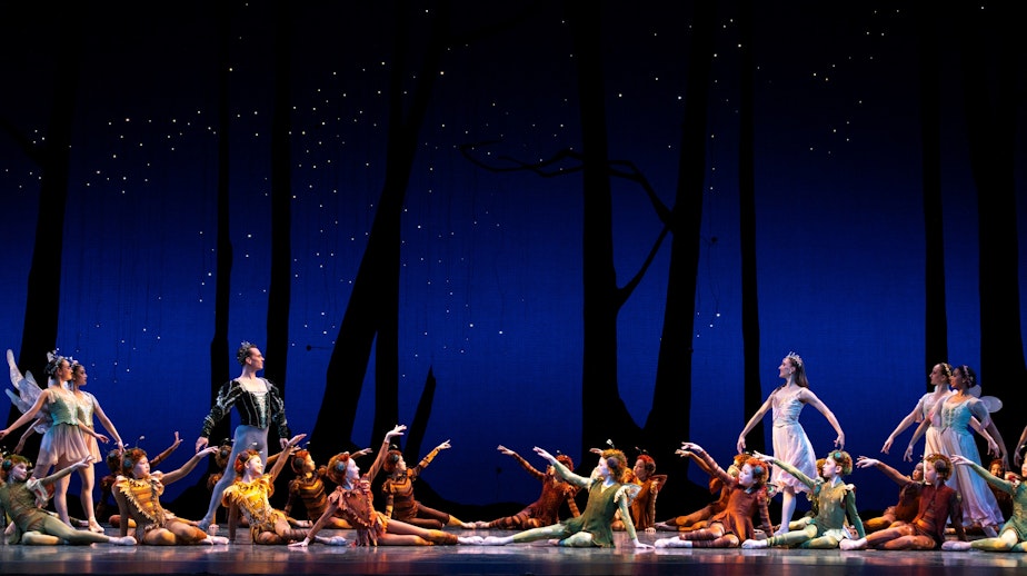 caption: Pacific Northwest Ballet principal dancers Kyle Davis (as Oberon) and Elizabeth Murphy (as Titania) with PNB School students in A Midsummer Night’s Dream, choreographed by George Balanchine © The George Balanchine Trust. PNB presents the classic story ballet April 14–23, 2023, as part of its 50th Anniversary season. (Streaming digitally April 27 – May 1)