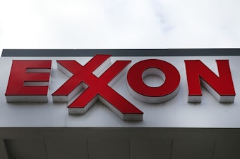 caption: A sign for an Exxon-branded gas station stands in Brooklyn, New York, on Oct. 28, 2016. Oil companies enjoyed a surge in profits in the first three months of 2022.
