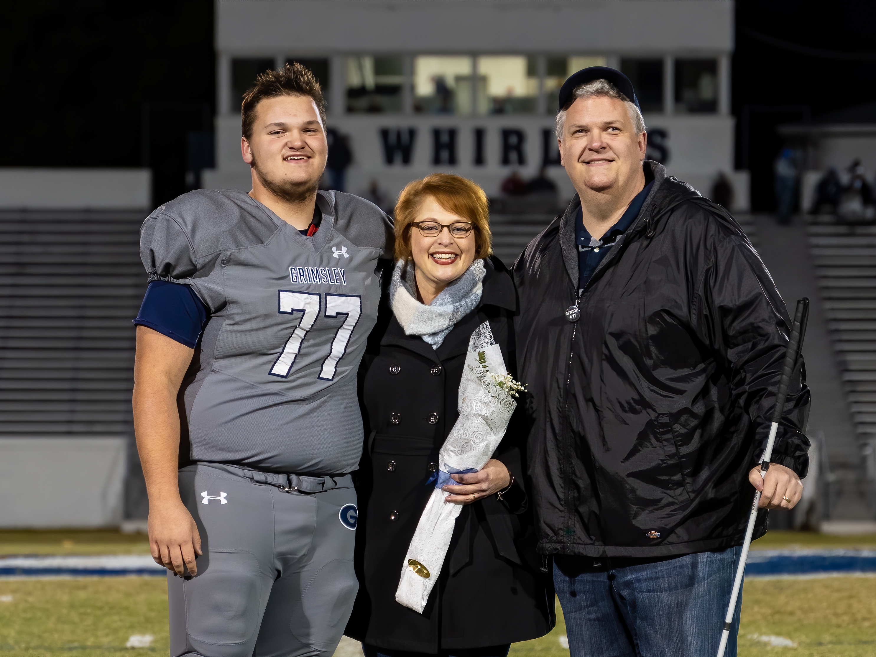 caption: Scott Thornhill with his wife Jane and their son Will after Will's final high school game at Grimsley HS in Greensboro, NC.