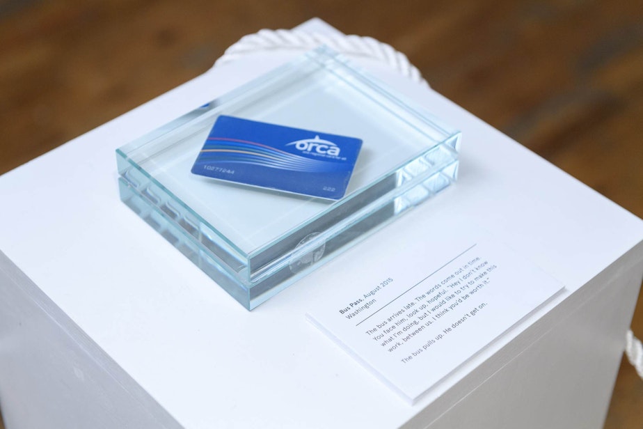 caption: An Orca card encased in glass tells the story of a reality that almost was.