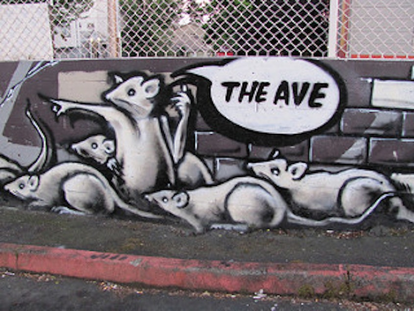 caption: A mural on NE 45th Street in the University District suggests we may have a problem.