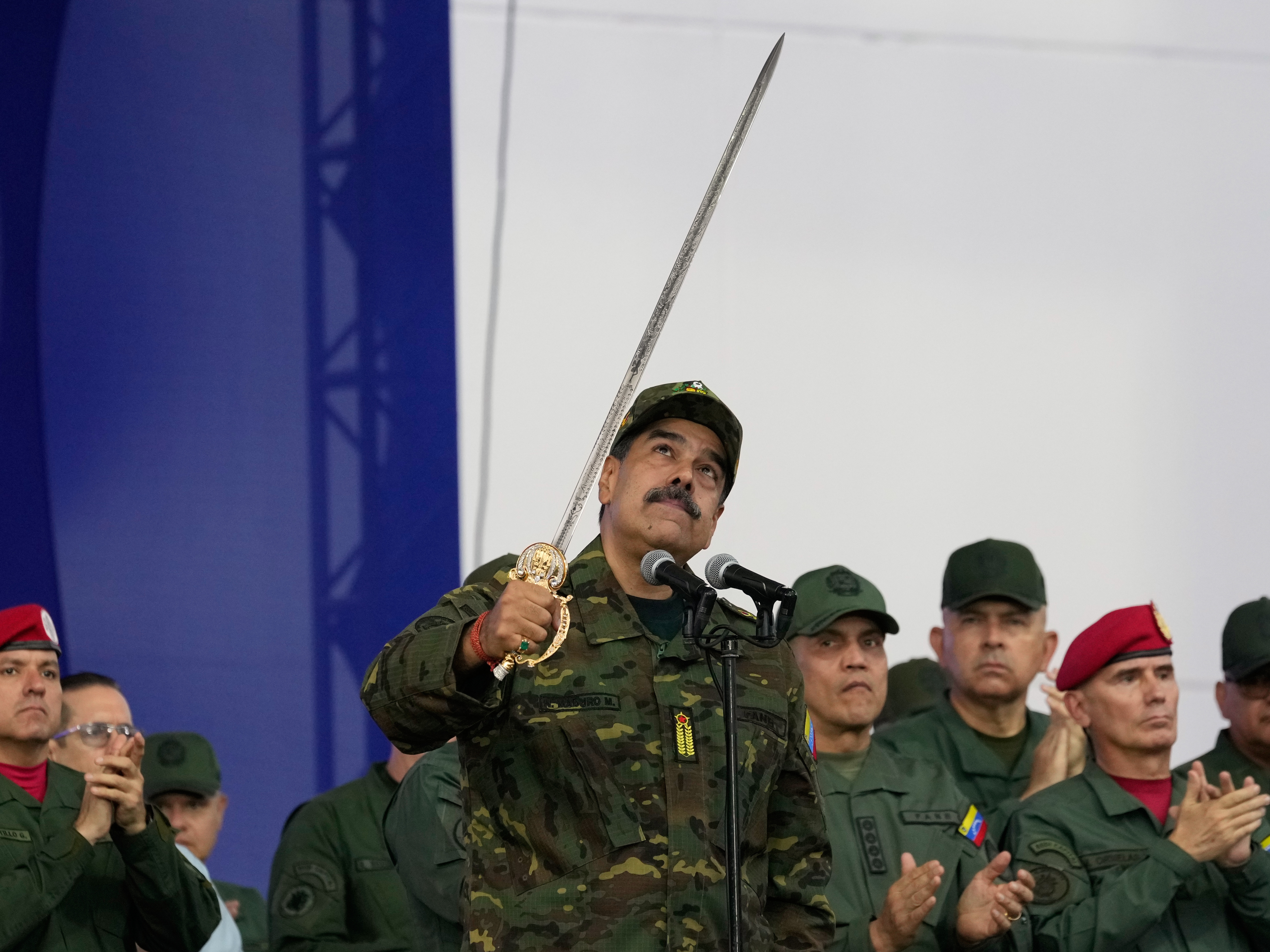 caption: Nicolás Maduro brandishes a sword on Nov. 25, 2025, in Venezuela's capital, Caracas, when he was still the country's president. U.S. forces seized Maduro on Jan. 3, part of President Trump's more aggressive foreign policy that has included multiple military operations in the past year.