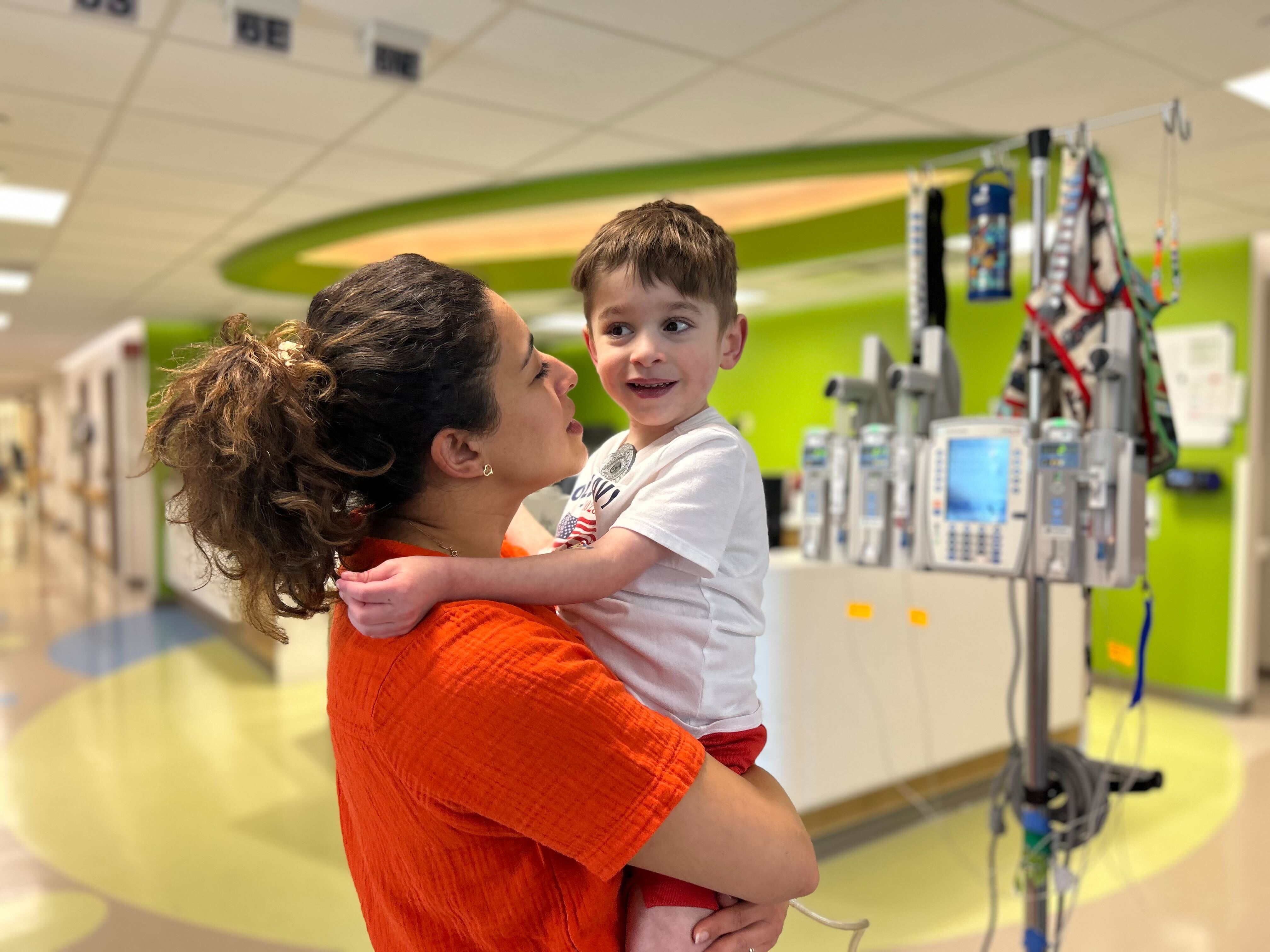 caption: Caleb Strickland, 4, has an artificial heart pump keeping him alive while he waits for a transplant. Nora Strickland, his mom, says she feels far away from the Trump administration's disputes with universities.