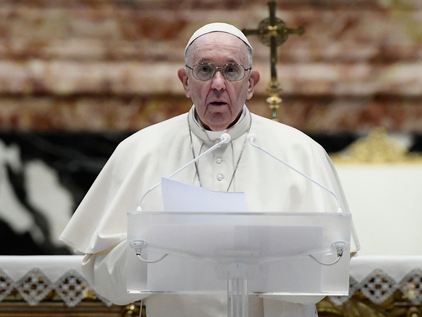 caption: Pope Francis speaks prior to delivering his Urbi et Orbi blessing after celebrating Easter Mass on Sunday at St. Peter's Basilica in the Vatican.
