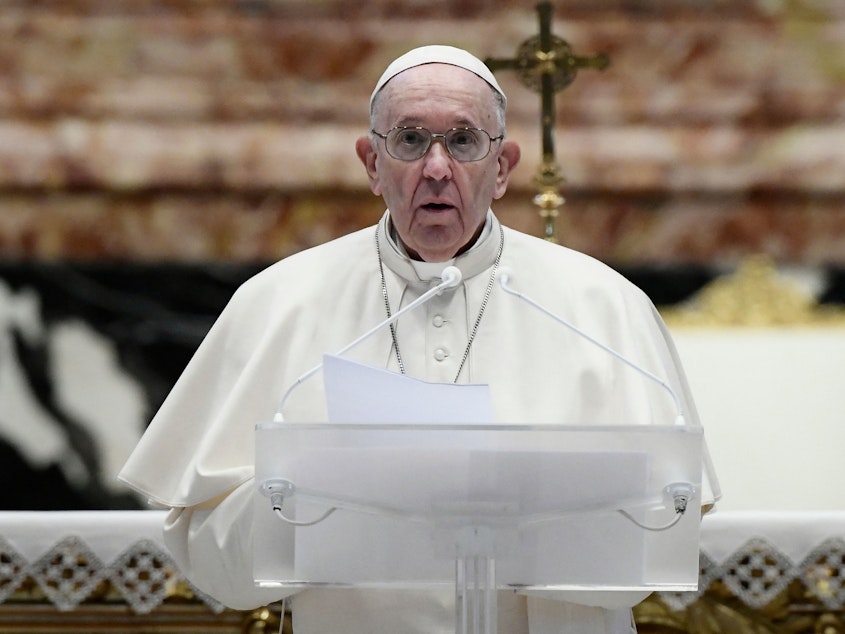 caption: Pope Francis speaks prior to delivering his Urbi et Orbi blessing after celebrating Easter Mass on Sunday at St. Peter's Basilica in the Vatican.