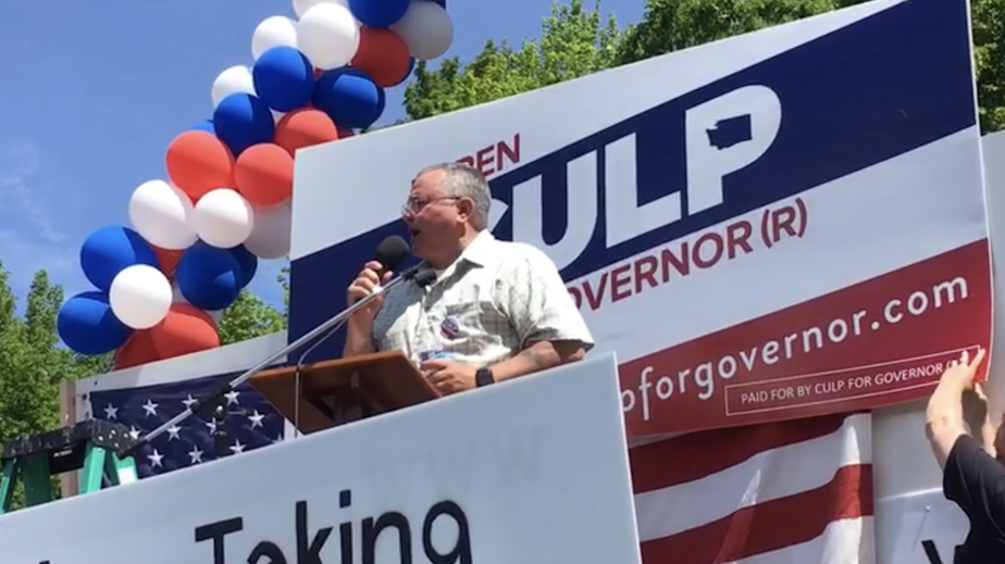 caption: Republican candidate for Washington governor Loren Culp speaks at a protest rally in May.