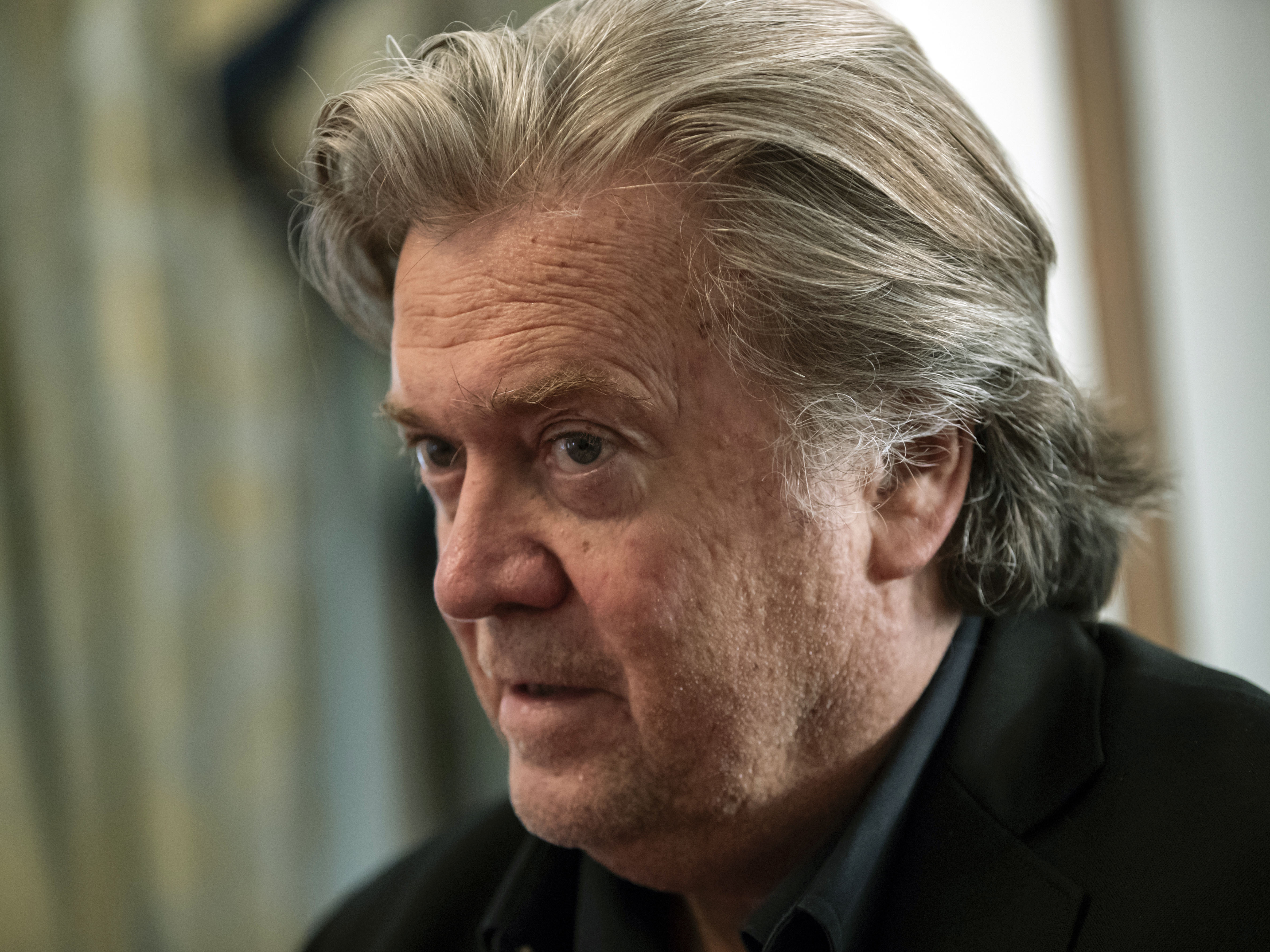 caption: Steve Bannon, once former President Donald Trump's chief strategist, is pictured in August 2018. The Justice Department has charged him with criminal contempt of Congress.