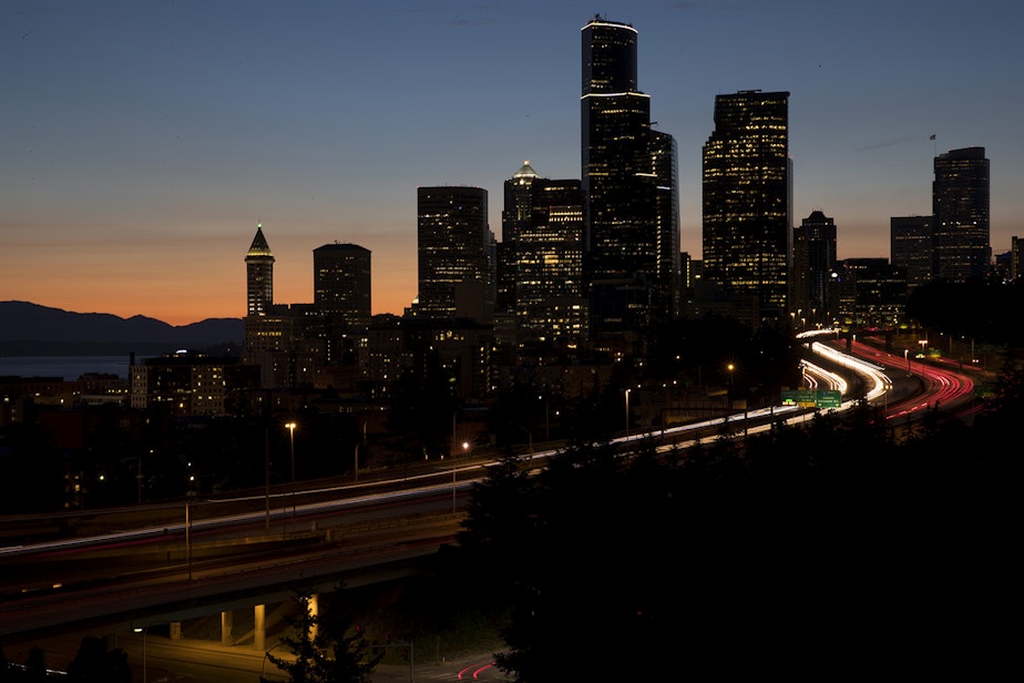 caption: Traffic in downtown Seattle is shown on Monday, July 17, 2017, from Rizal Park.