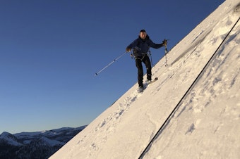 caption: In this photo provided by Jason Torlano, Zach Milligan is shown on his descent down Half Dome in Yosemite National Park, Calif., on Feb. 21. The two men climbed some 4,000 feet to the top of Yosemite's Half Dome in subfreezing temperatures and skied down the famously steep monolith to the valley floor.